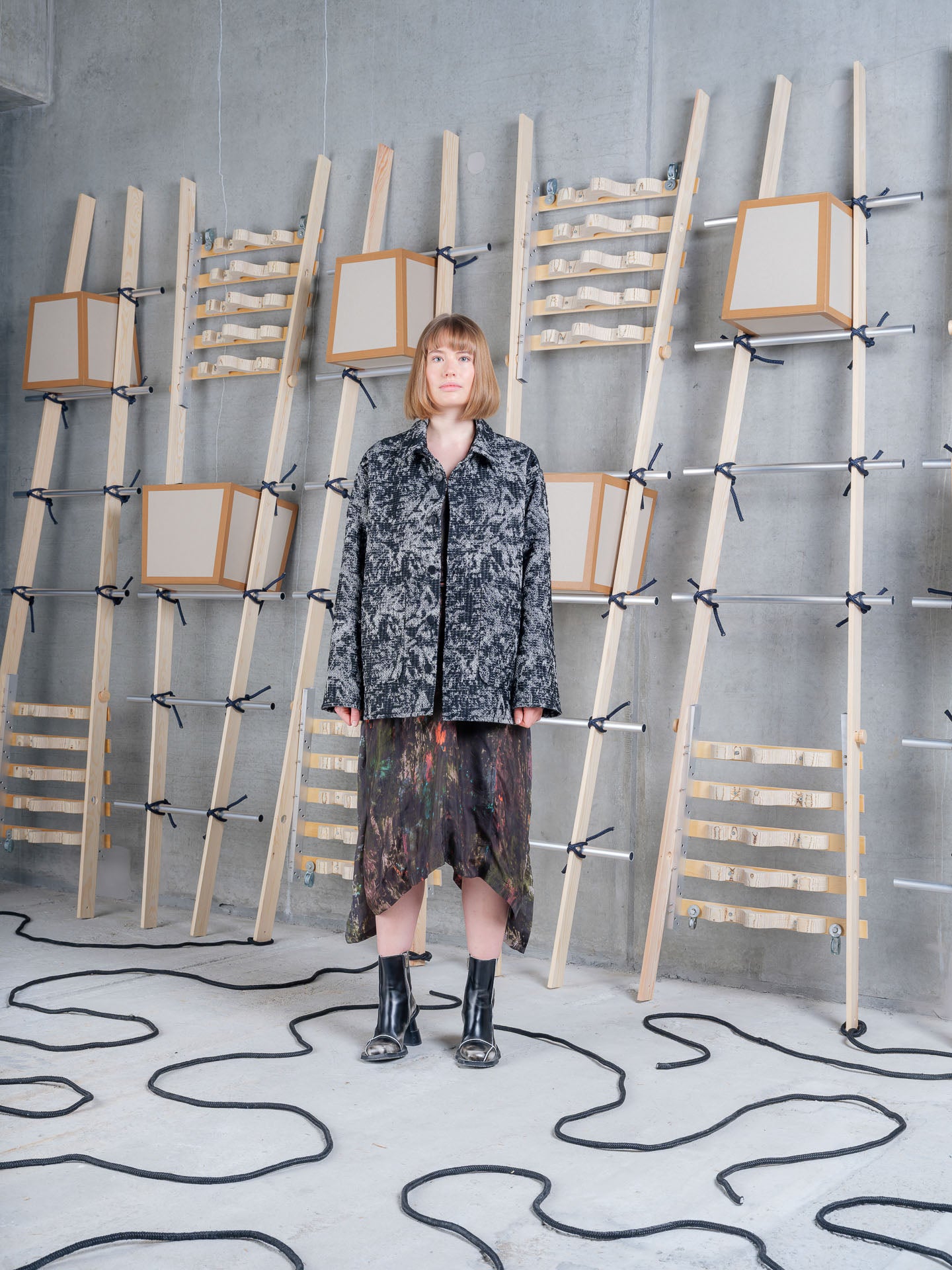 Cara wearing Henrik Vibskov Wheel Jacket in Black 3D White, front view.