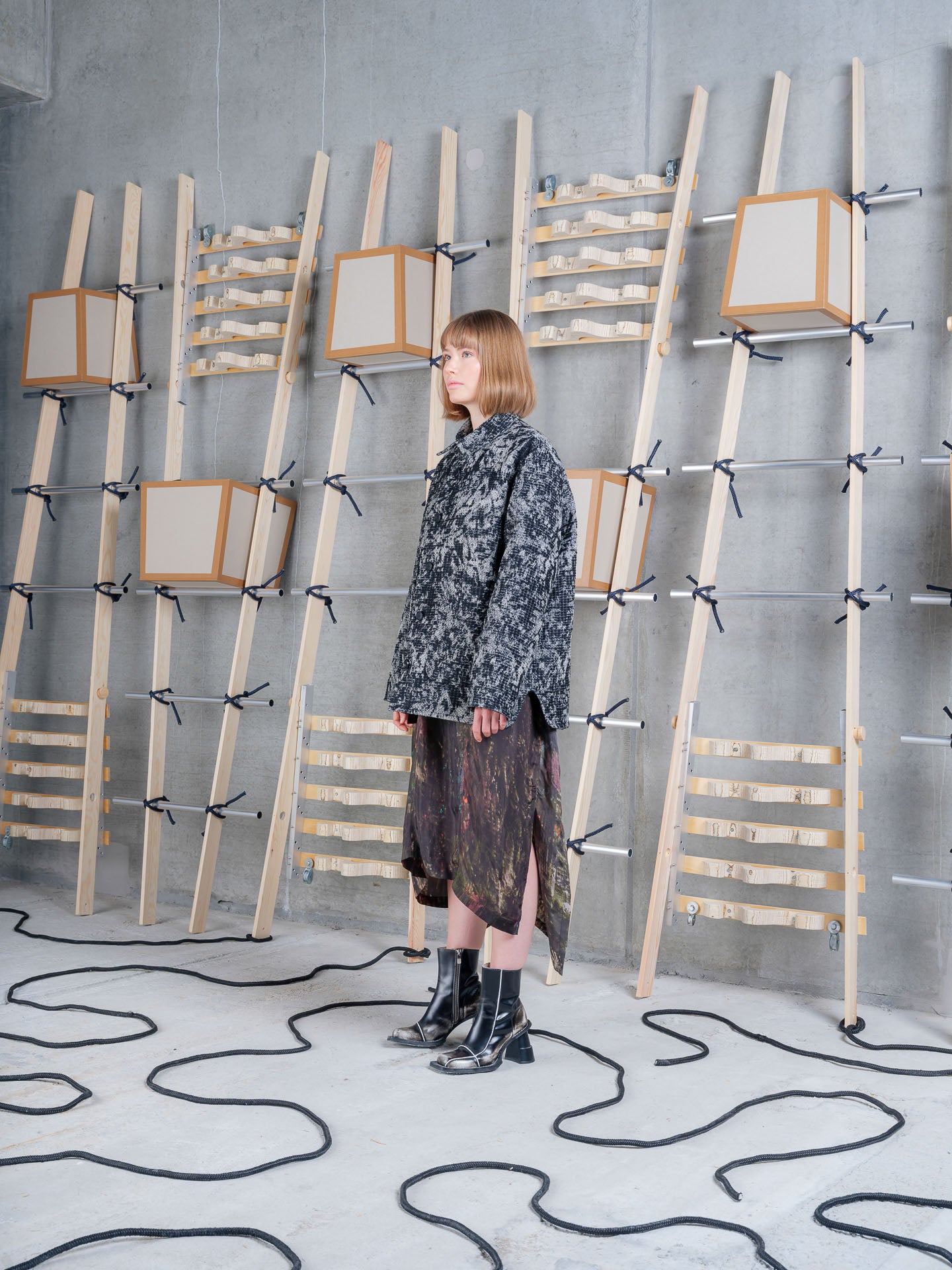 Cara wearing Henrik Vibskov Wheel Jacket in Black 3D White, side view.
