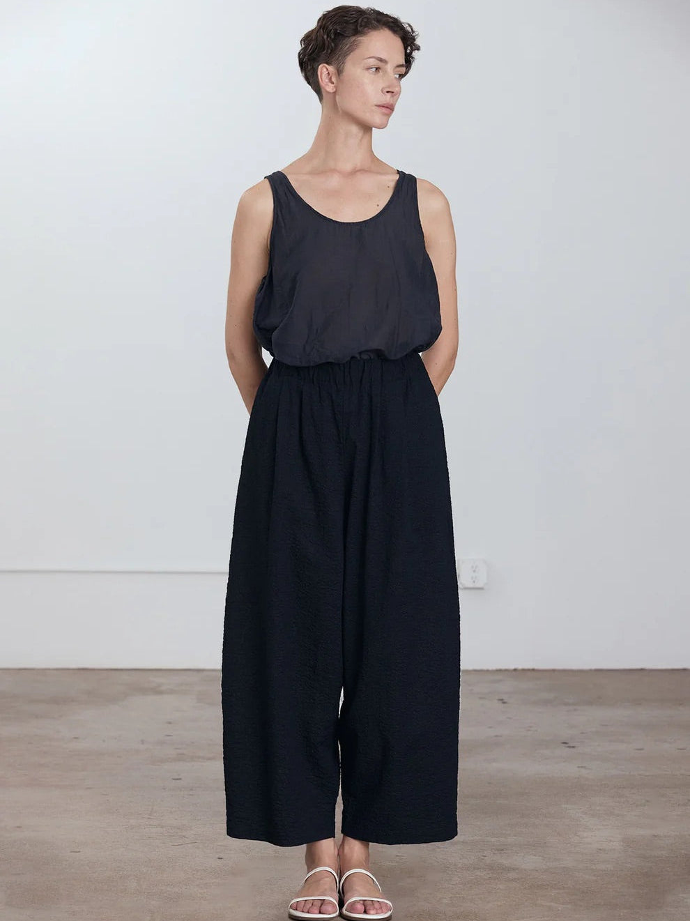 Black Crane Wide Pants in Midnight - front view on model showing wide silhouette and elasticised waistband