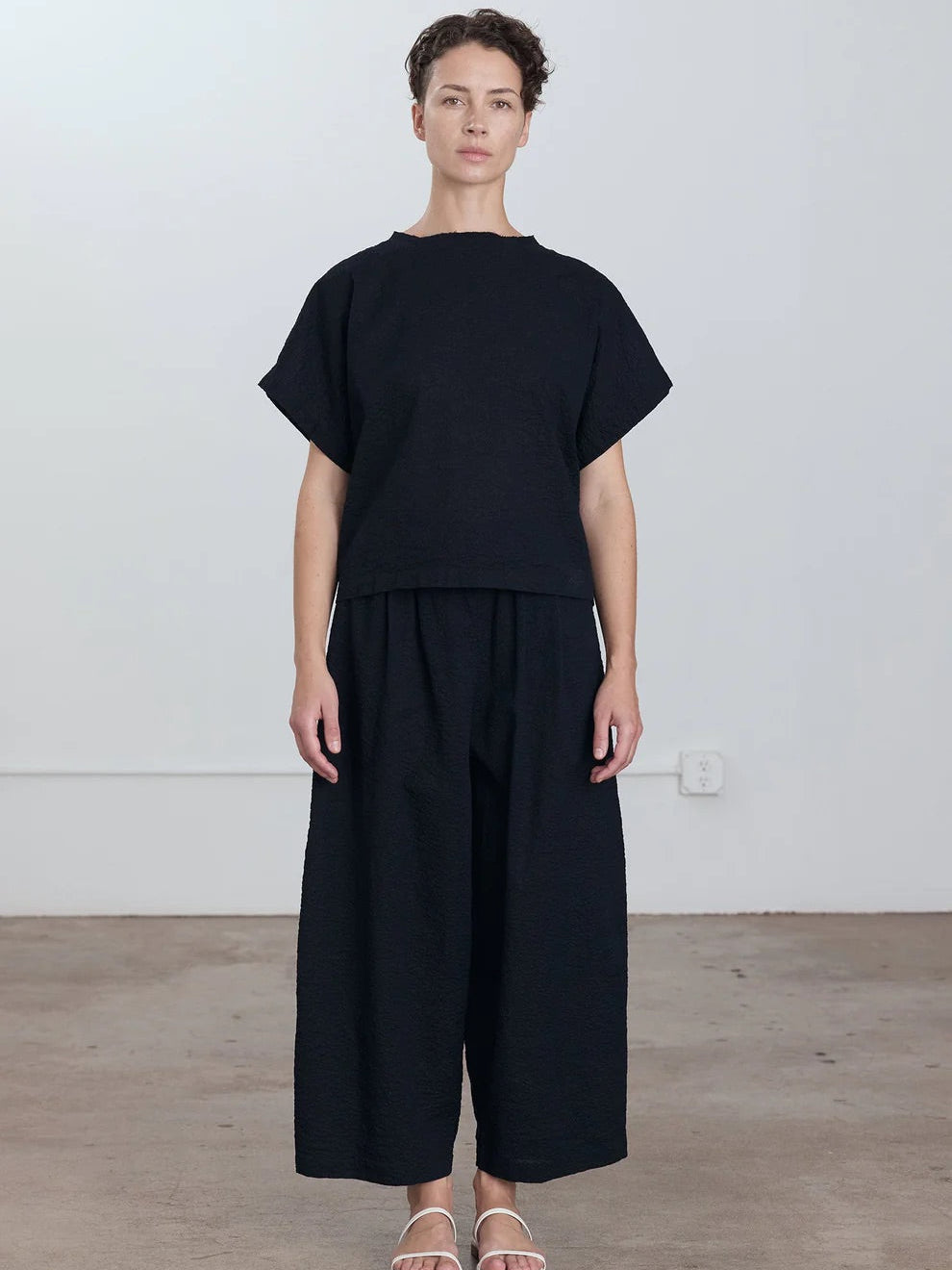 Black Crane Wide Pants in Midnight - full length view on model showing wide pants styled with coordinating top