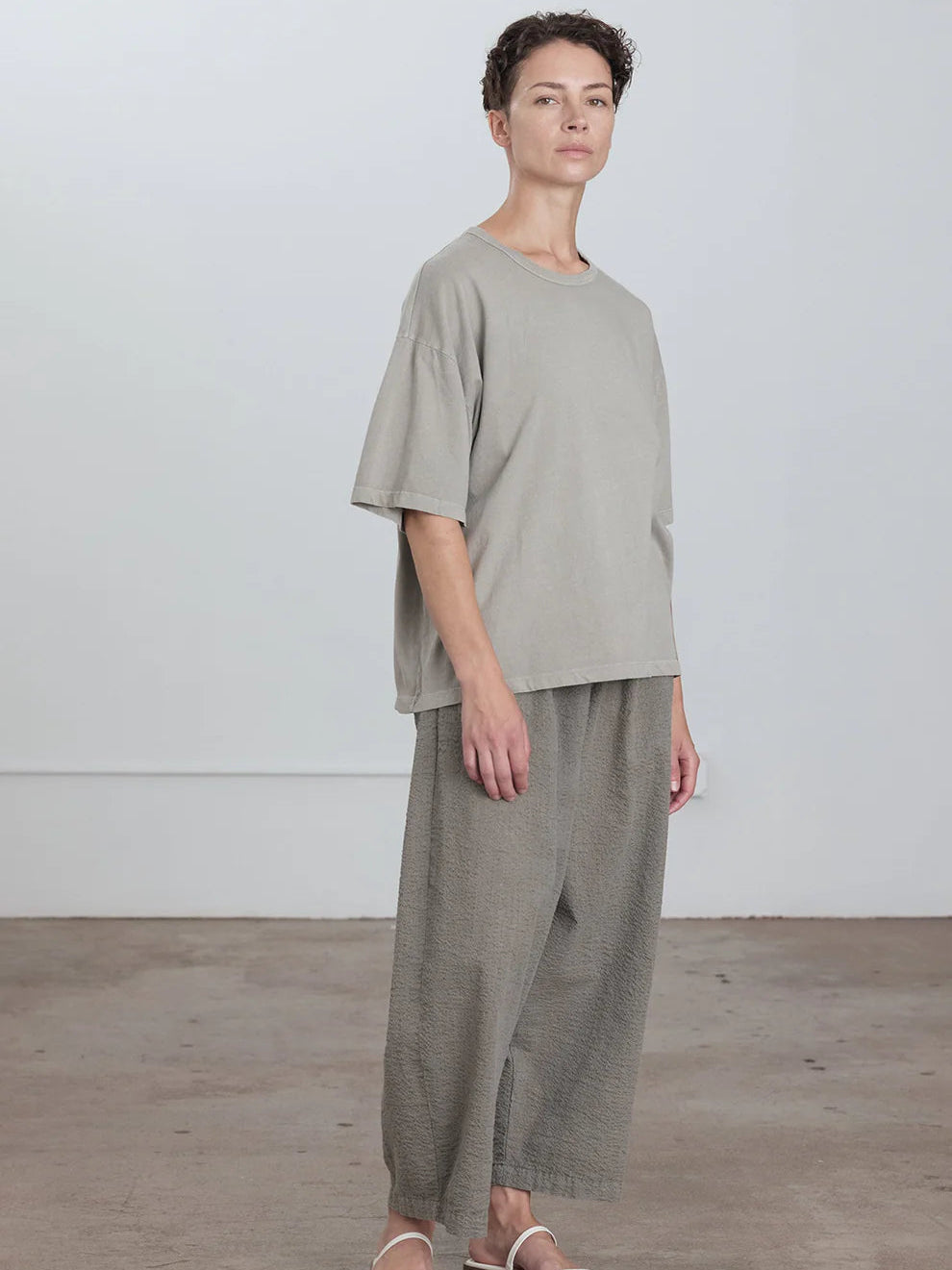 Black Crane Wide Short Sleeve Tee in Grey - full length front view on model showing dropped shoulder and oversized fit