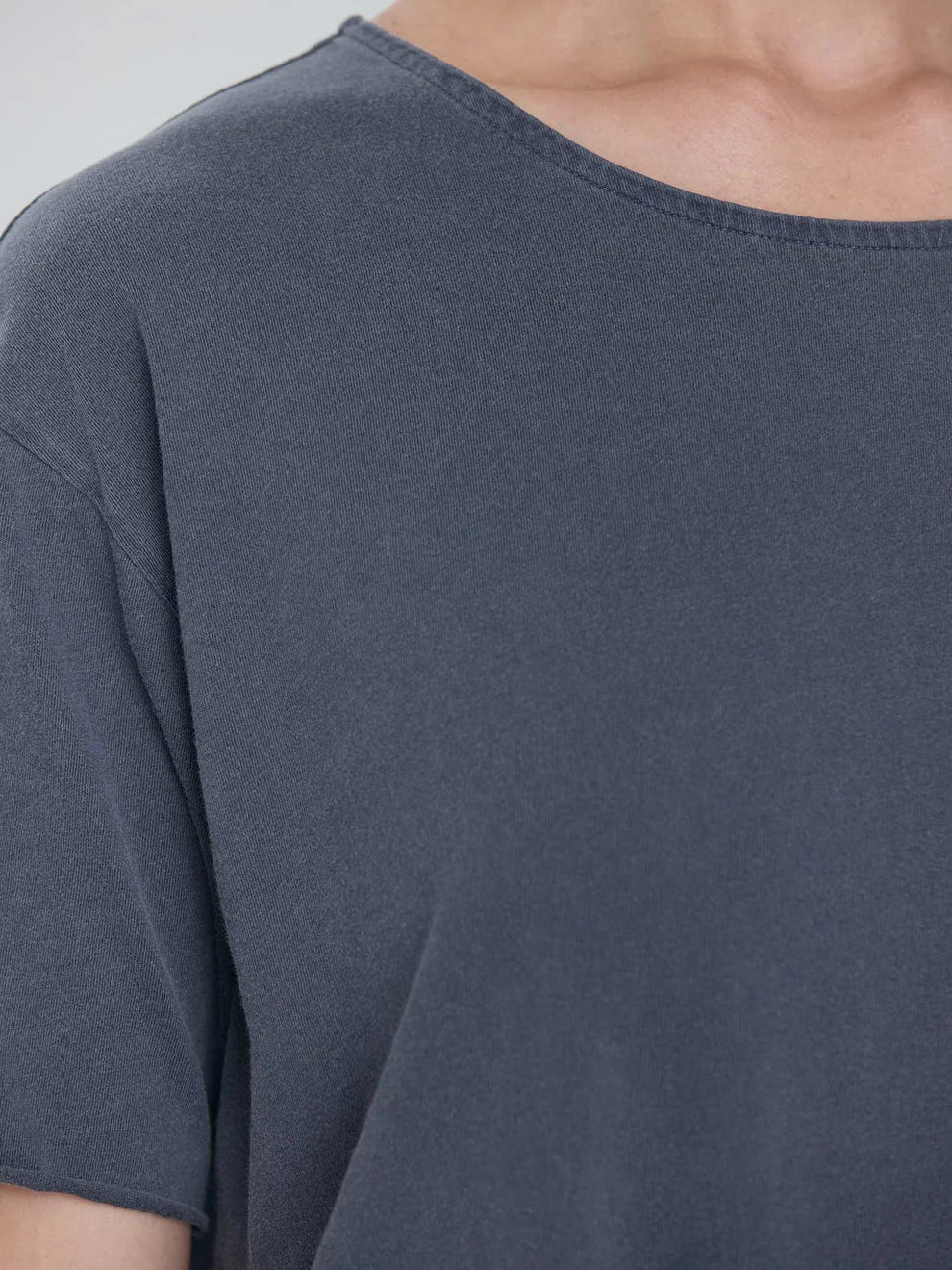 Black Crane Wide Short Sleeve Tee in Indigo - detail view showing crew neck and Japanese textured jersey fabric