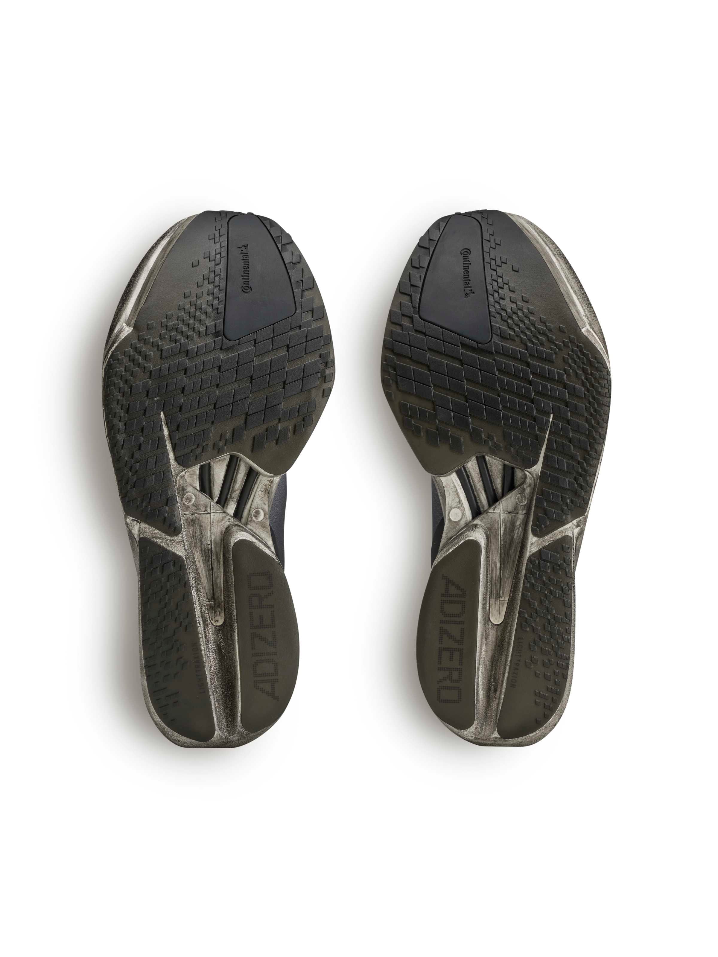 Y-3 Adios Pro 4 outsole view, rubber outsole tread pattern, sculptural midsole profile, distressed finish, LightstrikePro foam base