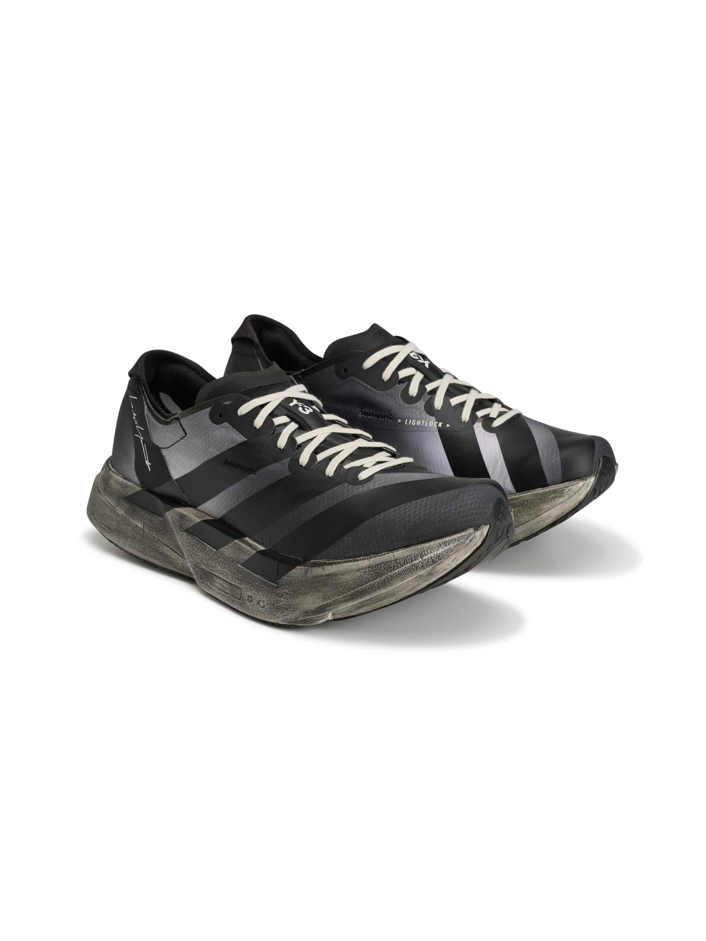 Y-3 Adios Pro 4 in Black Off White Grey Five, three-quarter front view, Lightlock upper system, tonal 3-Stripes, off-white lacing, distressed sculptural midsole