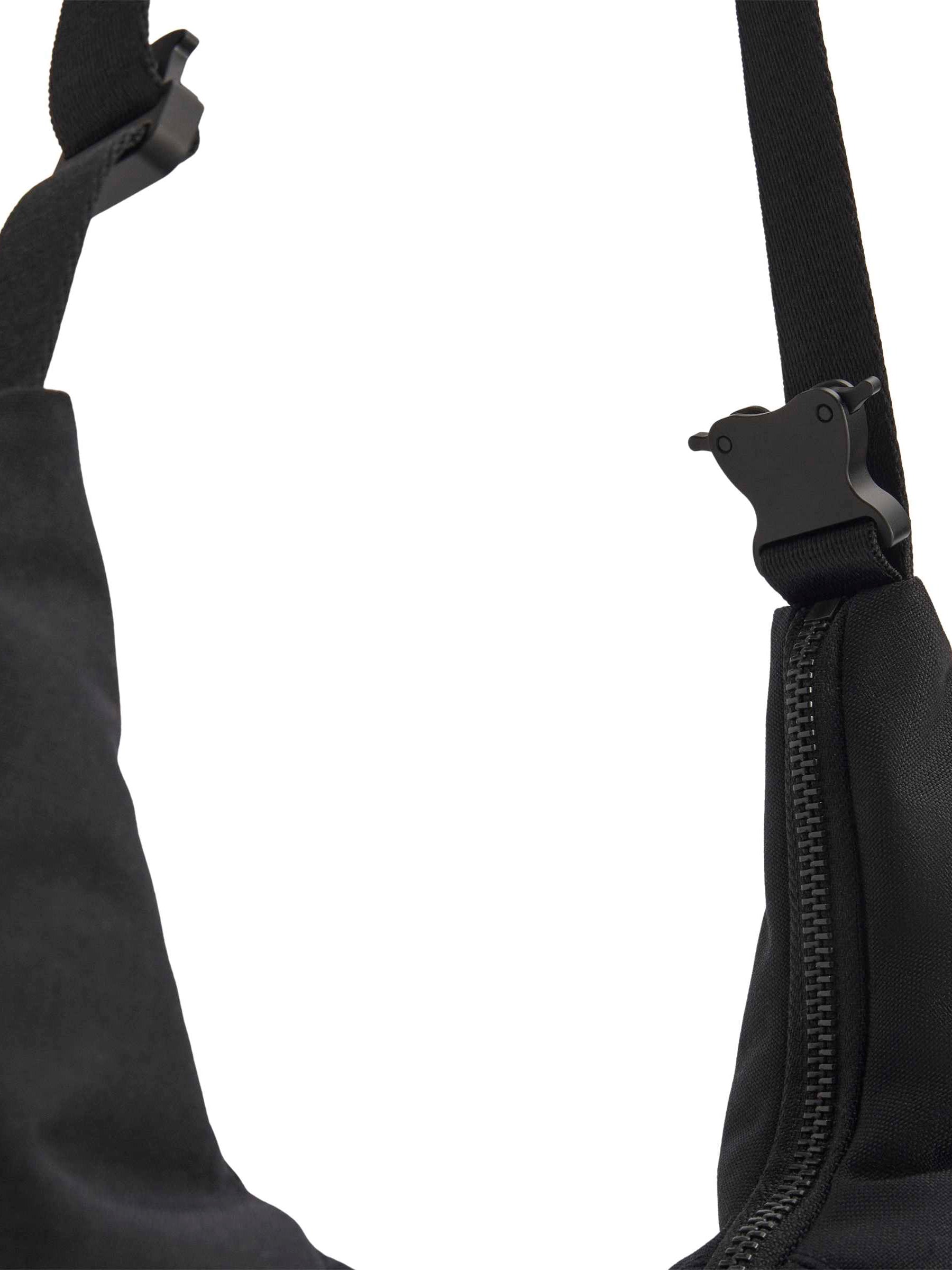 Y-3 Crescent Bag strap detail, adjustable black webbing, gunmetal buckle hardware close-up, tonal hardware finish