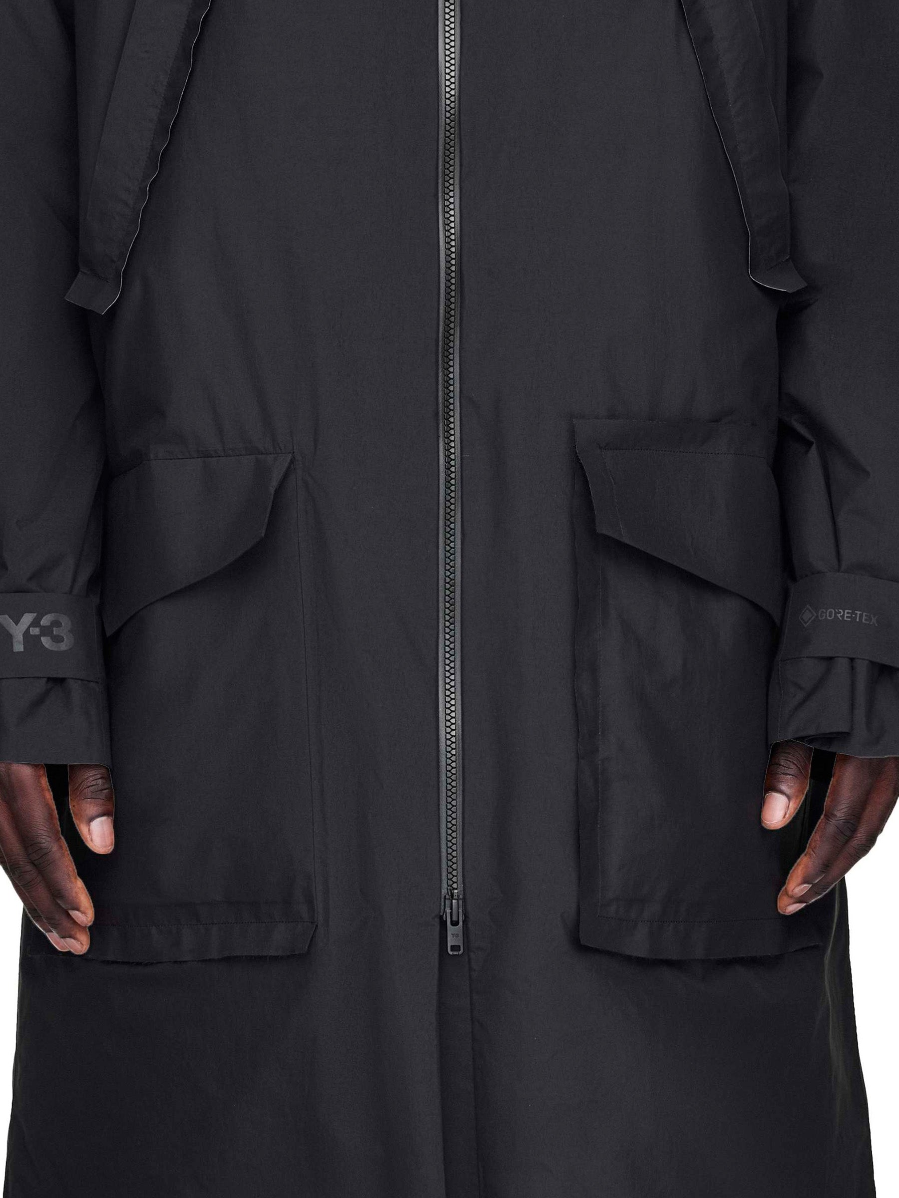 Black coat with a zipper and Y-3 logo on a white background