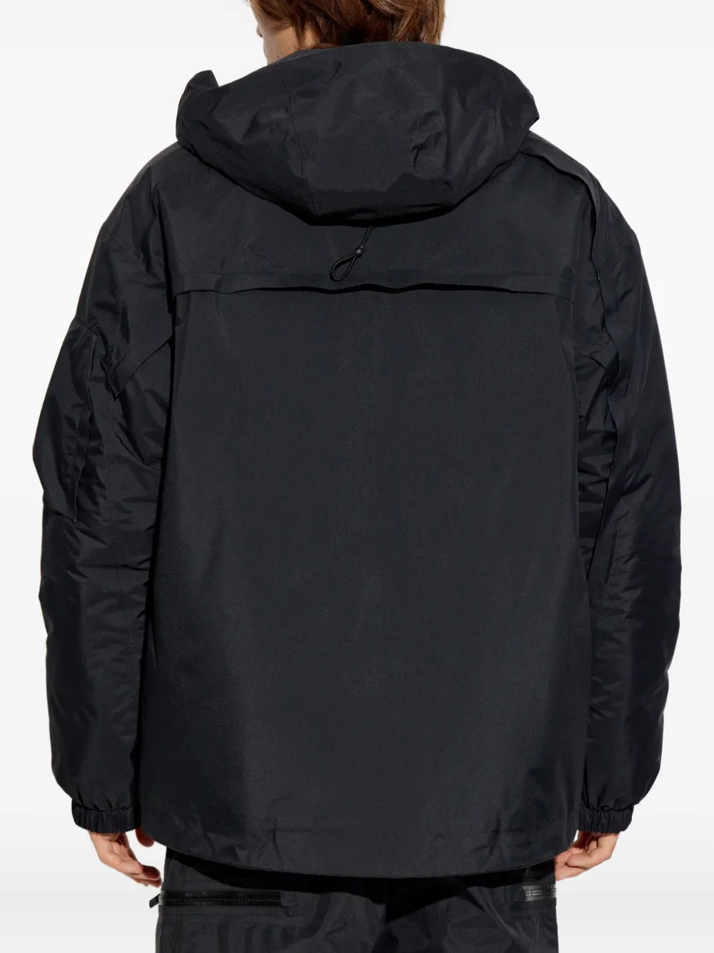 Person wearing Y-3's gote-tex jacket in black