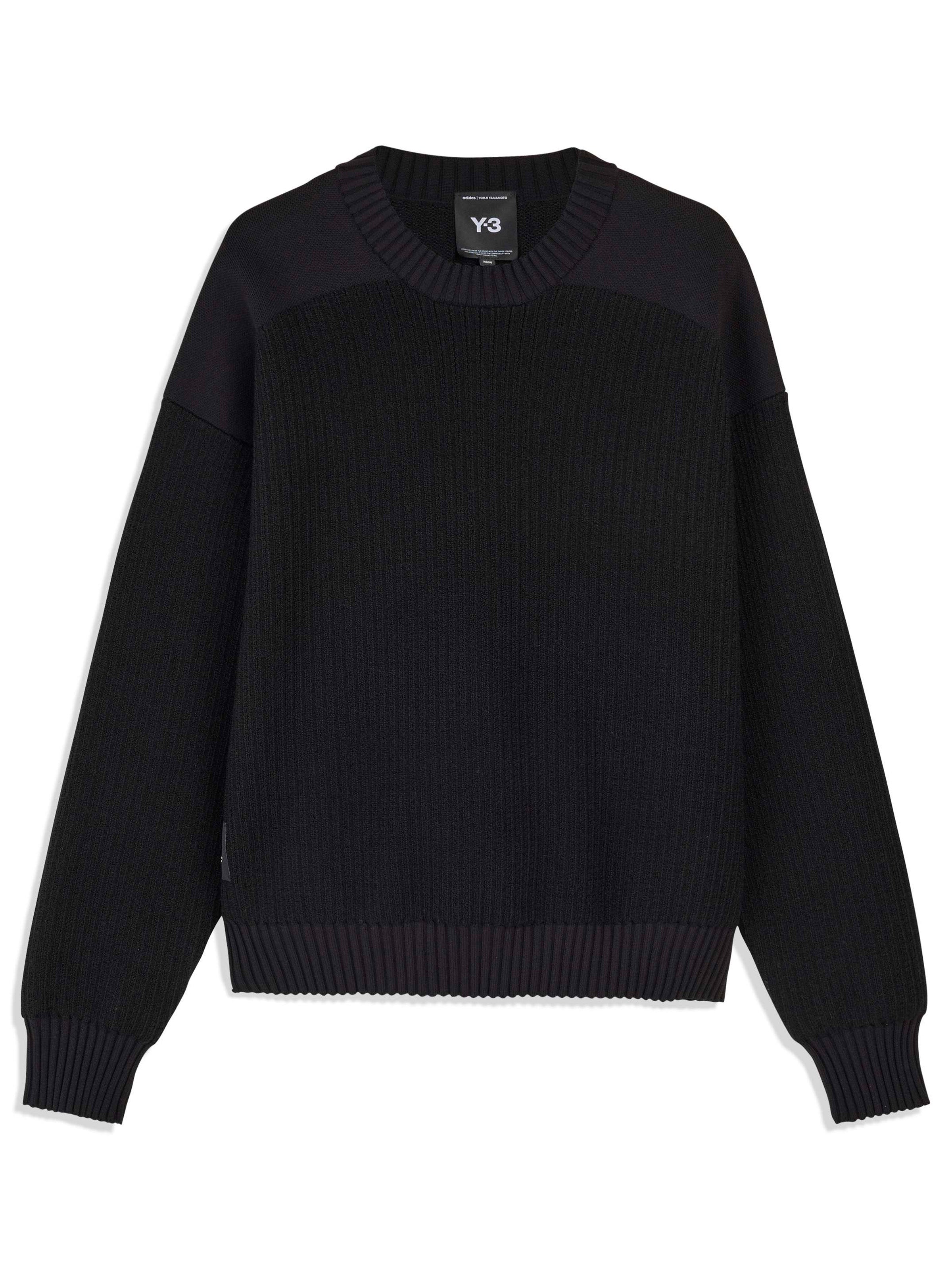 Black sweater with a Y-3 brand label on a white background