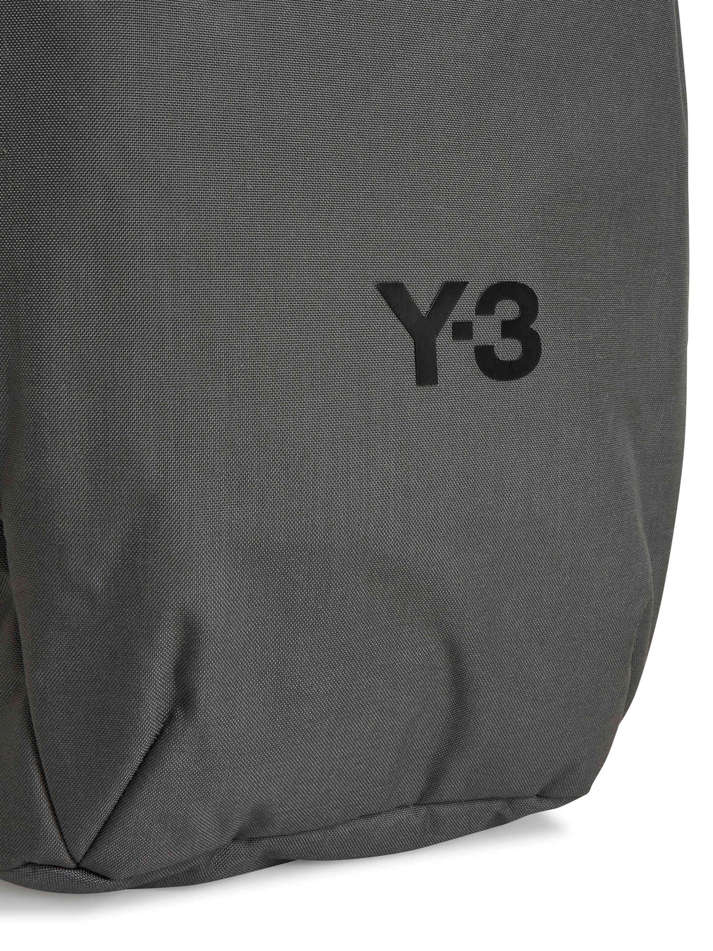 Gray backpack with Y-3 logo on a white background
