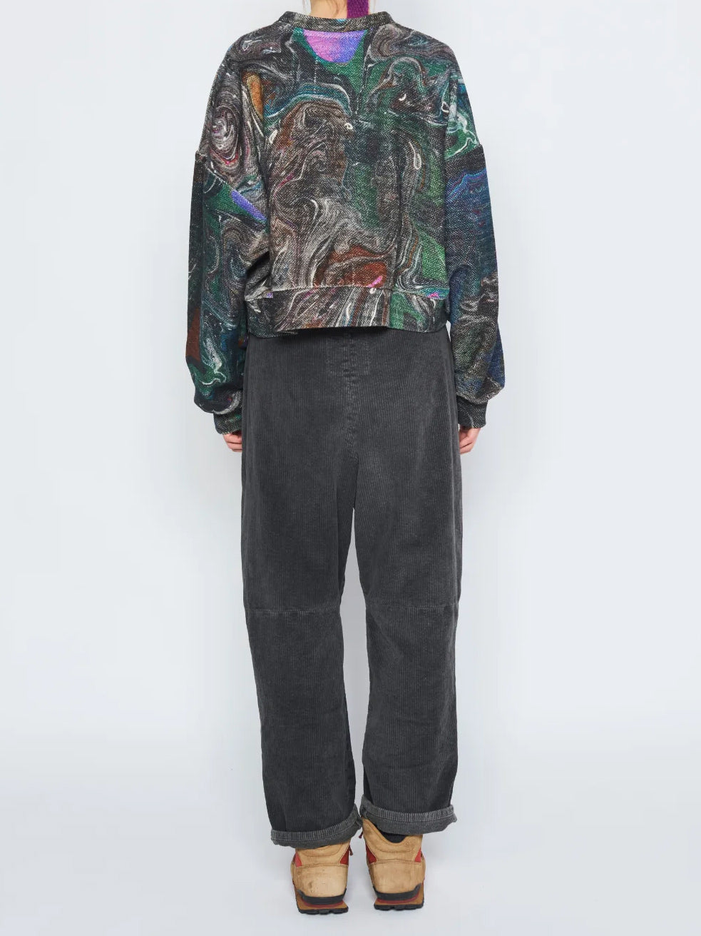 Anntian Short Sweater in Print D worn on model from the back, showing the abstract multicolour print and relaxed fit.