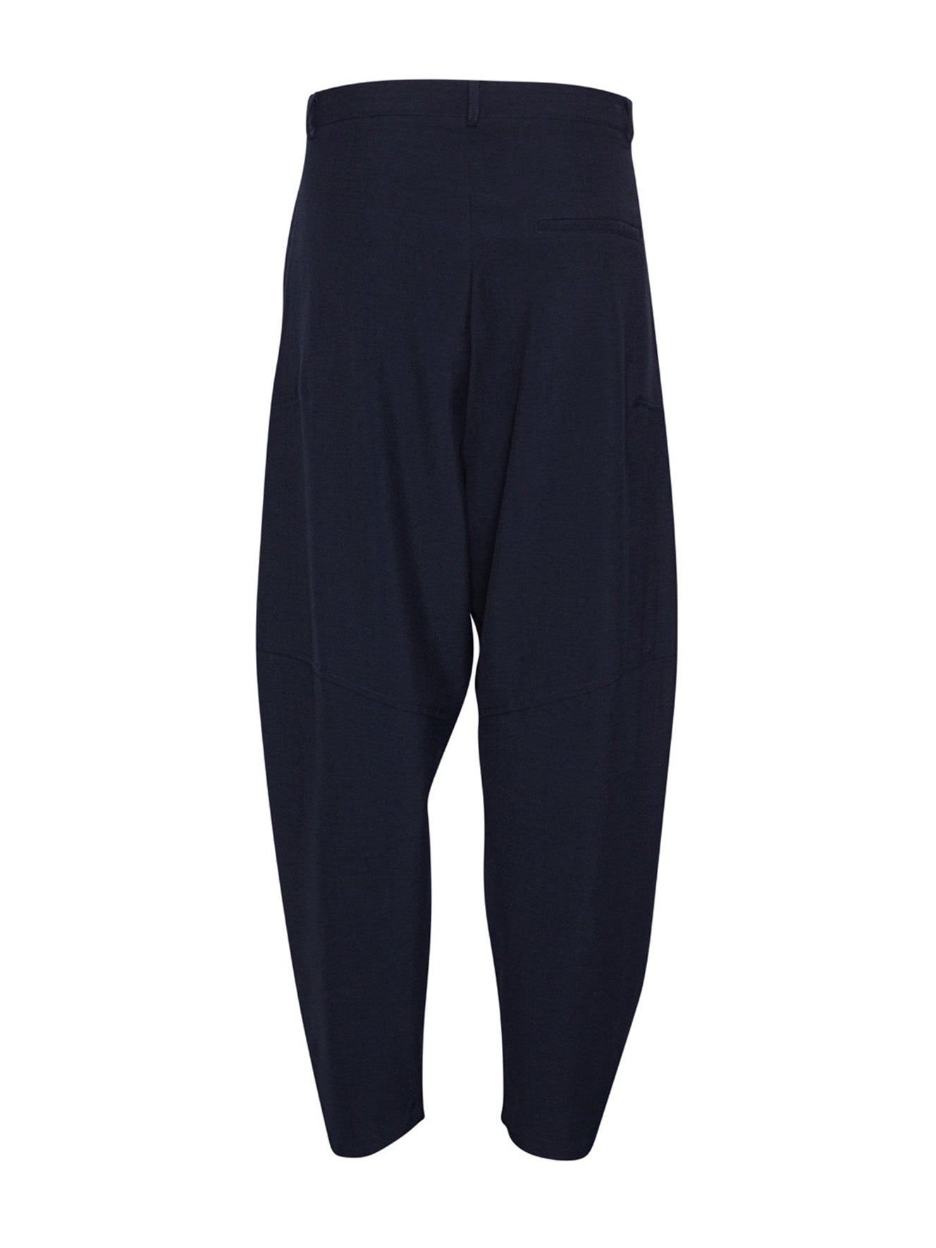 Back view of Henrik Vibskov Ants Pants in Dark Navy showcasing the relaxed tapered fit.
