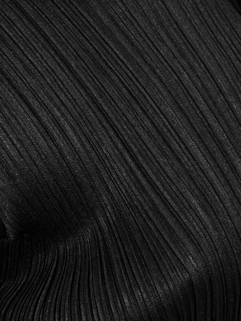 Close-up of the pleated fabric on the Pleats Please Issey Miyake April SS26 Swing Solid Dress in Black