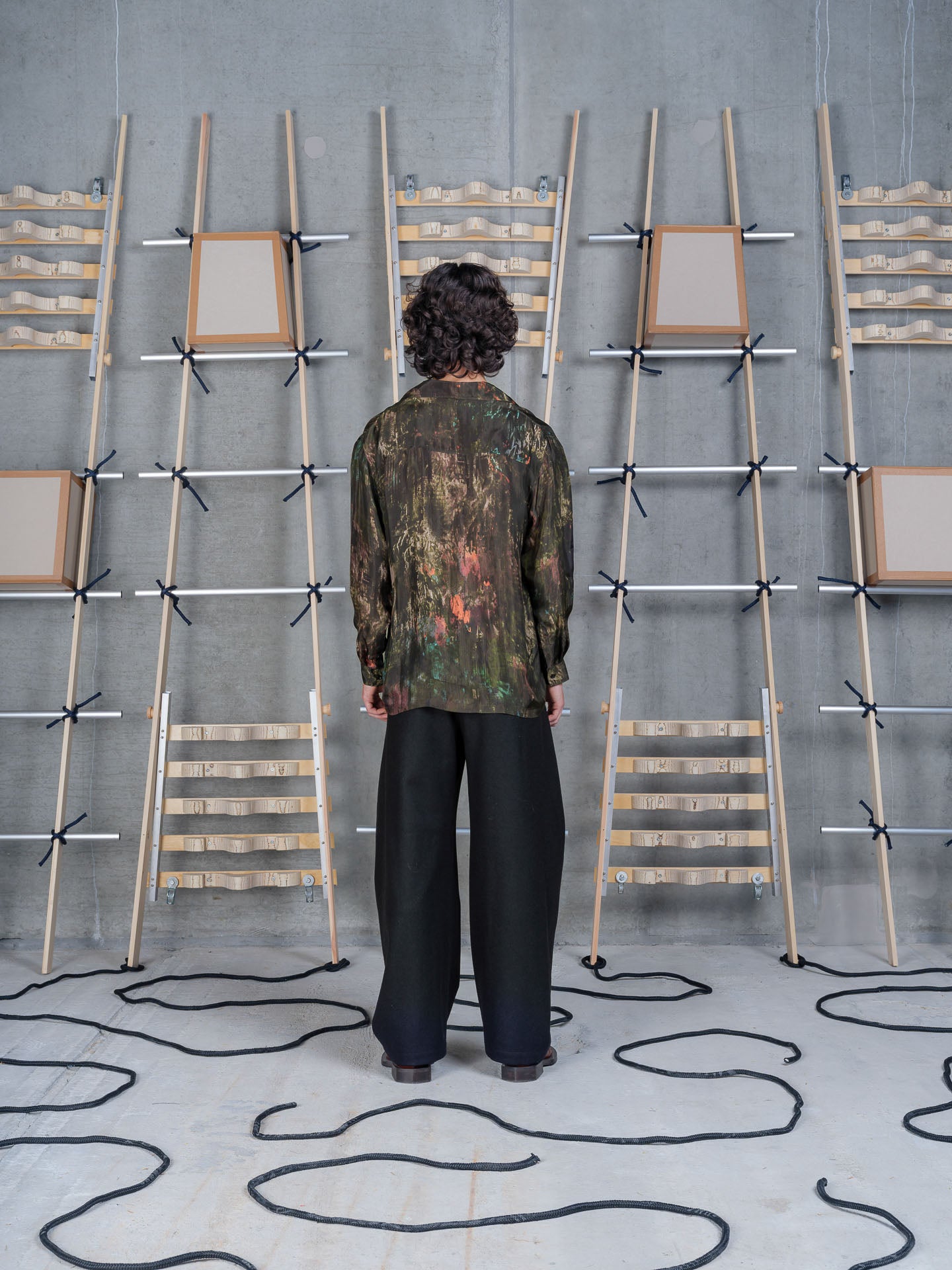 Model wearing Henrik Vibskov Artist Shirt LS in Swamp Reflections back view
