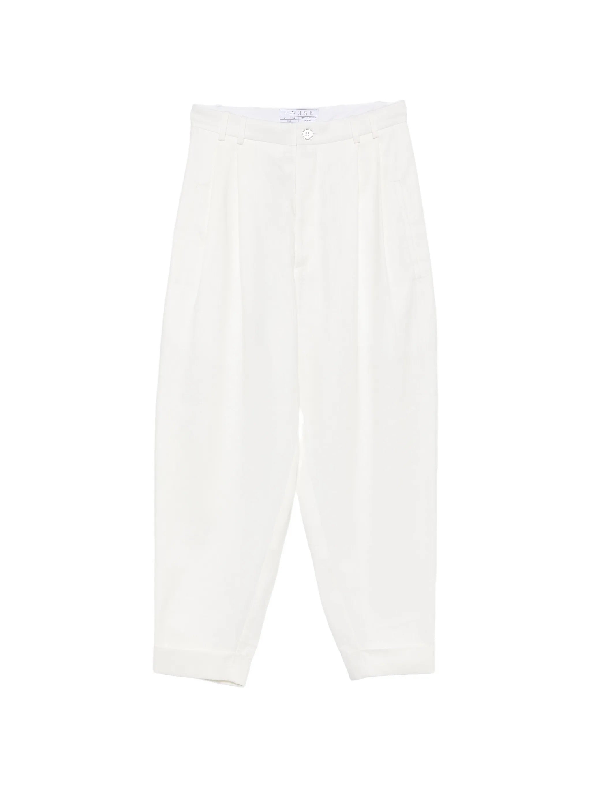 House Of The Very Islands Blake Trousers in Off White - flat lay showing tailored off white trousers with pleat details and turn-up hems