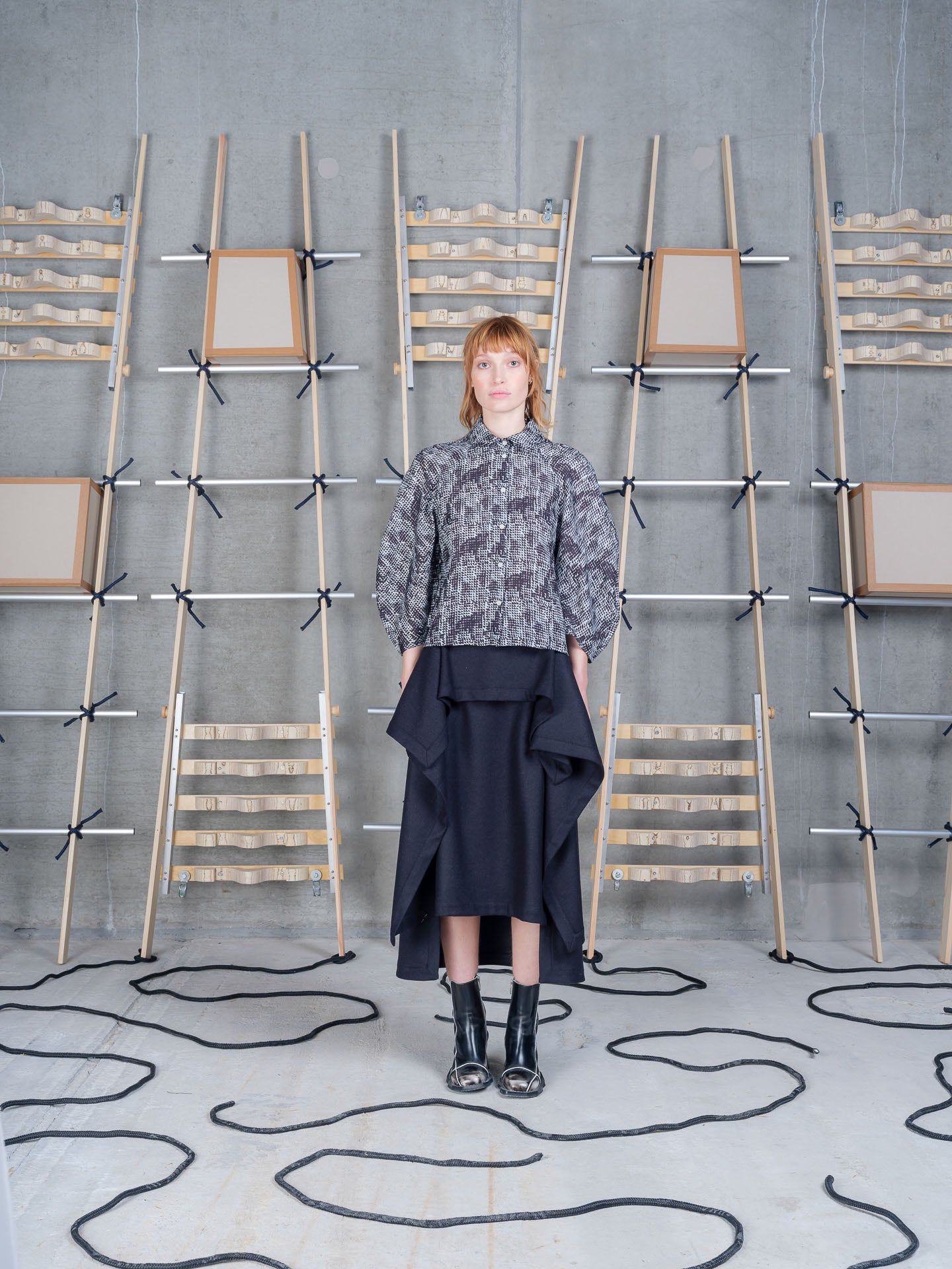 Model wearing Henrik Vibskov Blanket Skirt in Black front view
