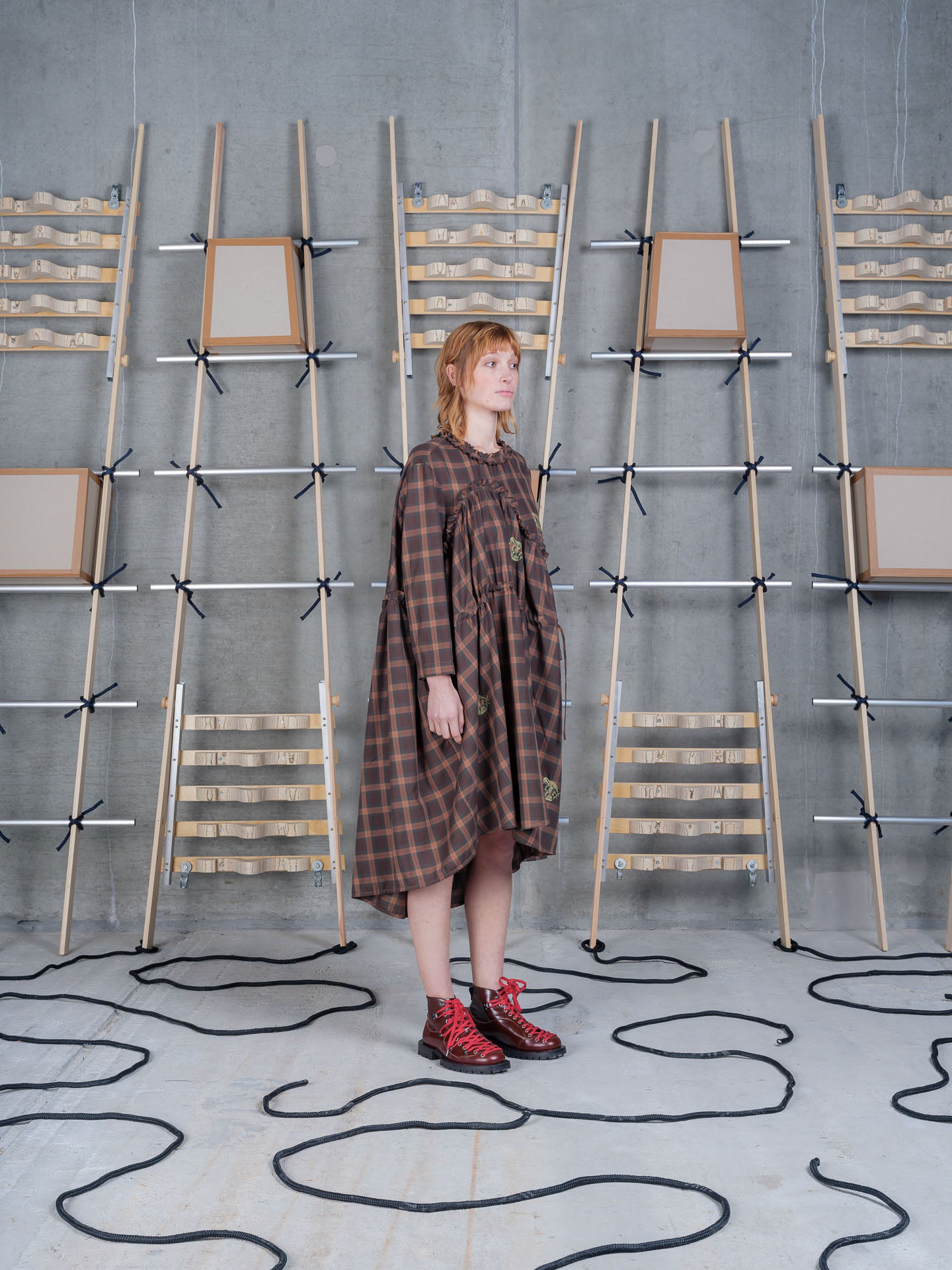 Side view of Henrik Vibskov Bon Chalant Dress LS in Brown Cotton Checks highlighting the oversized fit.