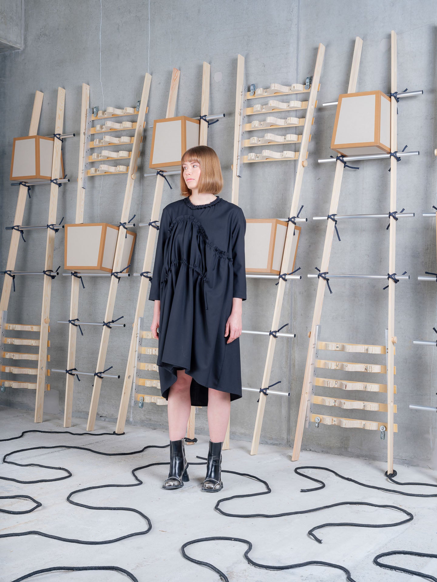 Model wearing Henrik Vibskov Bon Chalant Dress LS in Black side view
