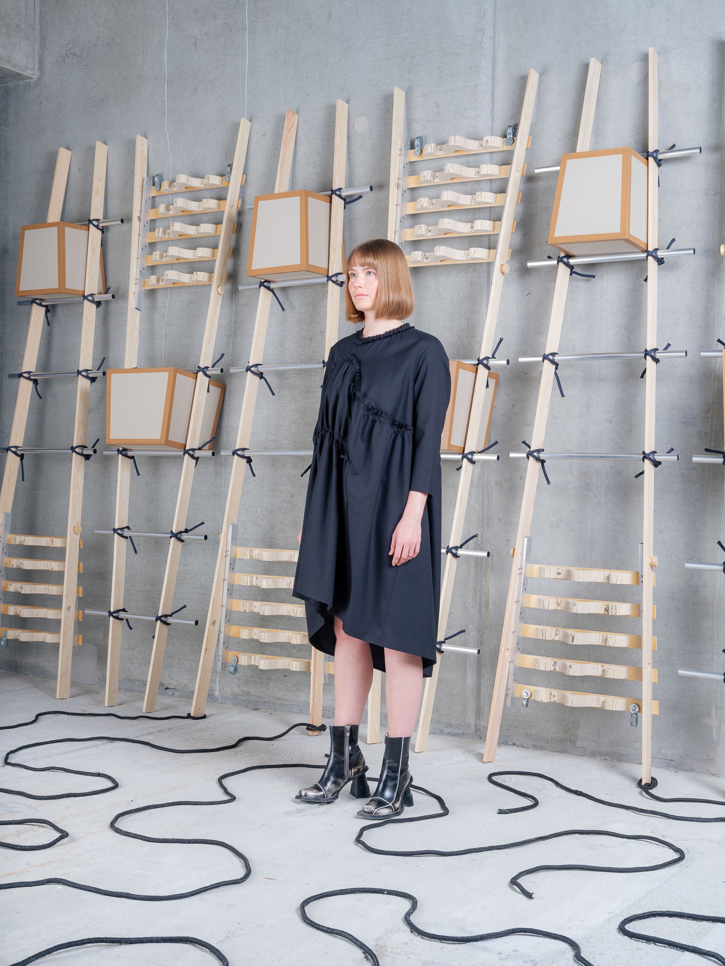 Model wearing Henrik Vibskov Bon Chalant Dress LS in Black side view