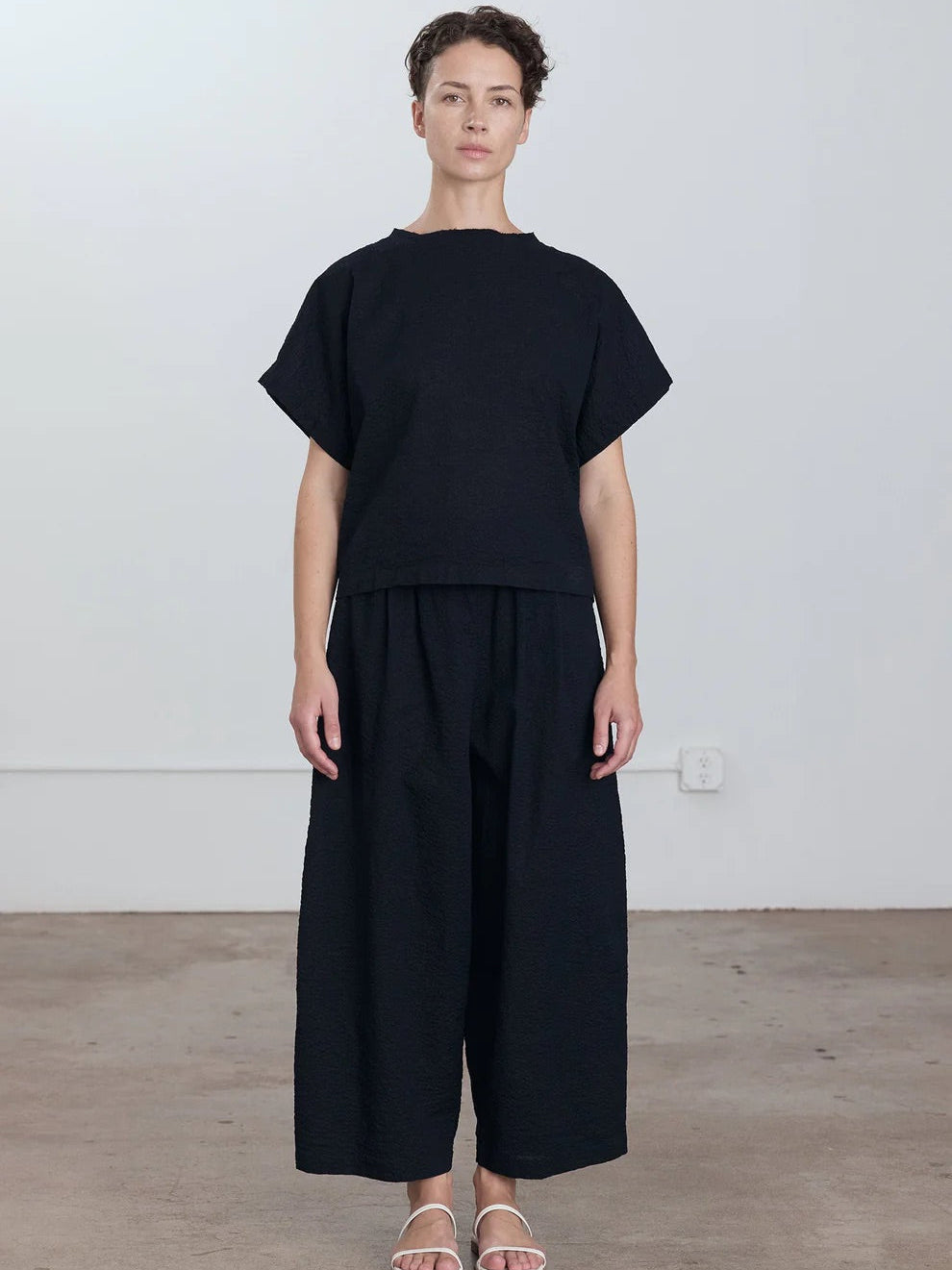 Black Crane Boxed Top in Midnight - side view on model showing boxed silhouette and relaxed fit
