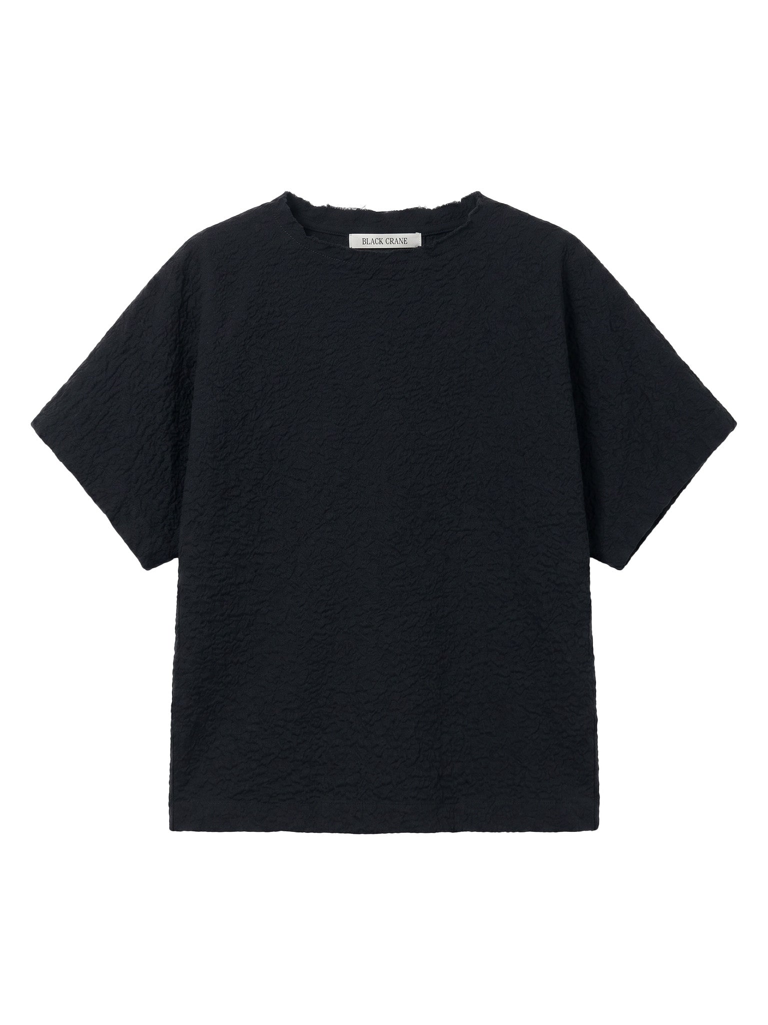 Black Crane Boxed Top in Midnight - flat lay showing boxy silhouette and raw edge frayed crew neck in ripple textured Japanese cotton