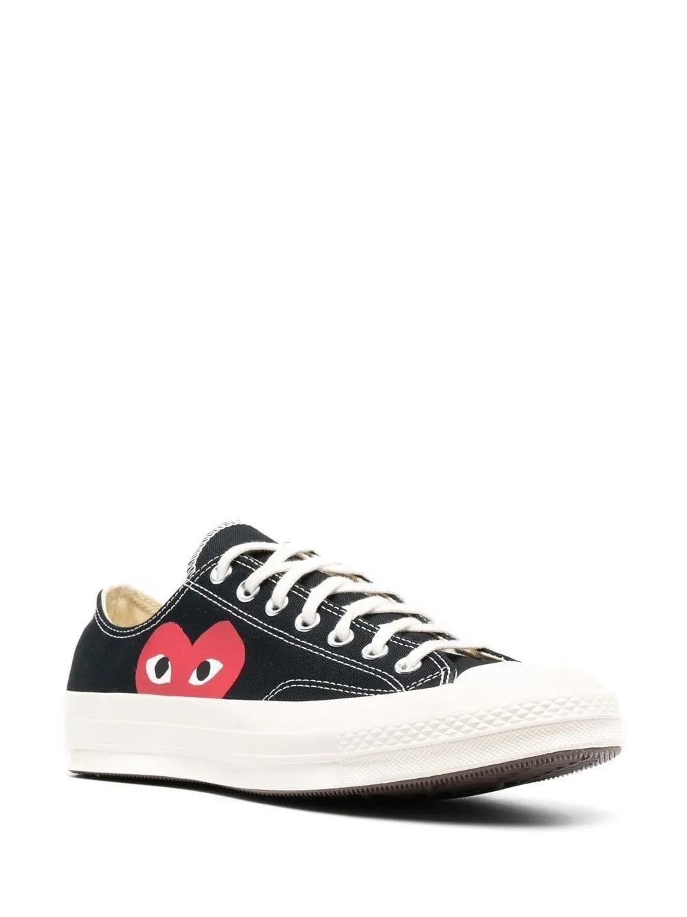 Comme des Garçons Play x Converse Chuck 70 low-top sneakers in black, three-quarter front view, contrast white topstitching and red heart logo detail