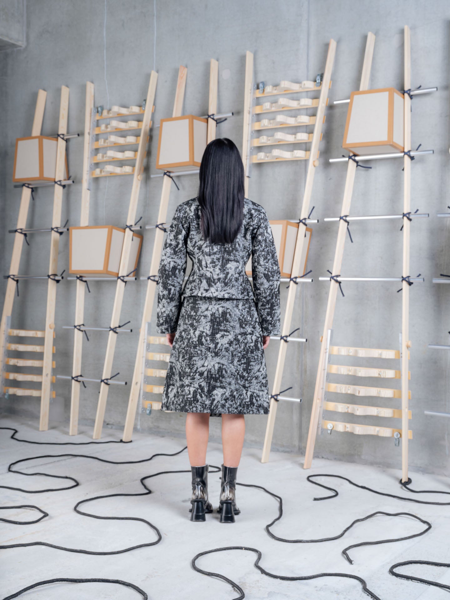 Model wearing Henrik Vibskov Carry Skirt in Black 3D White back view
