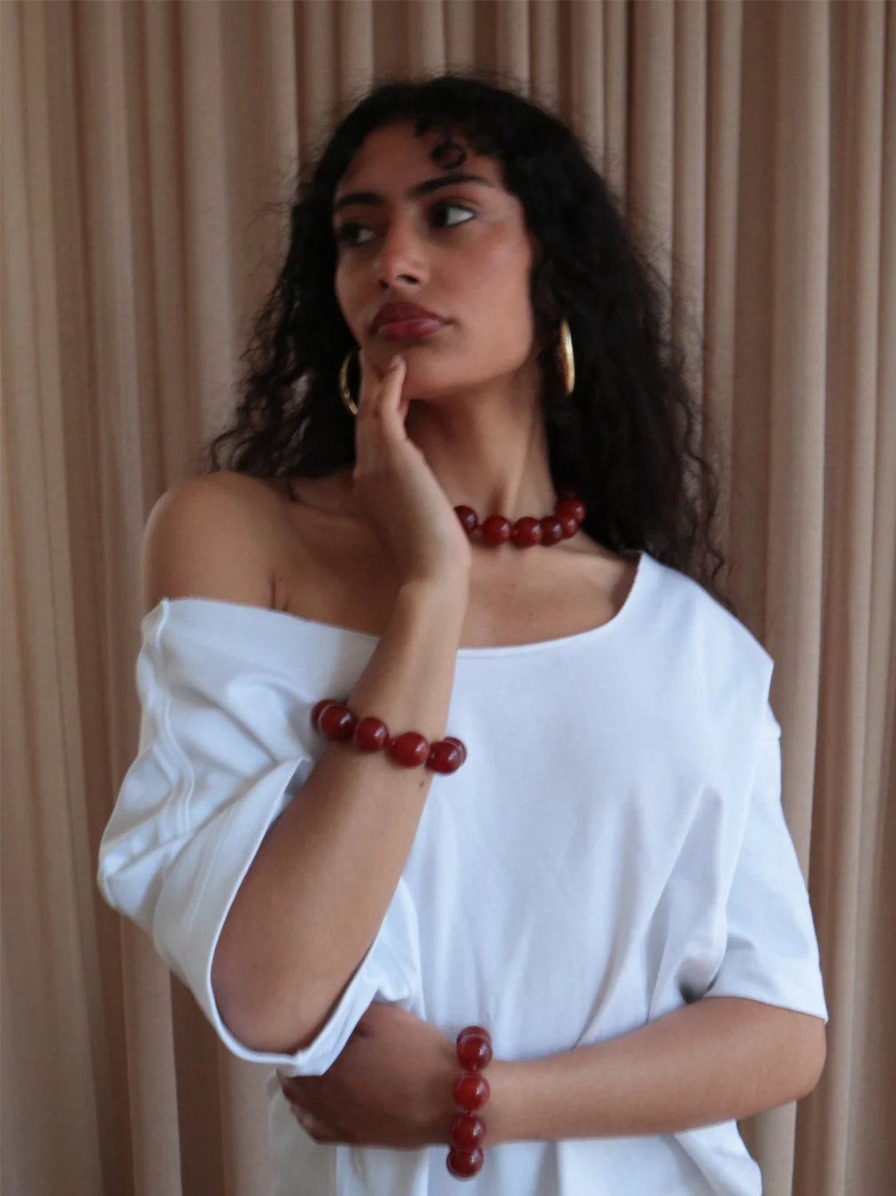 Woman wearing the red agate bracelet from De Silang
