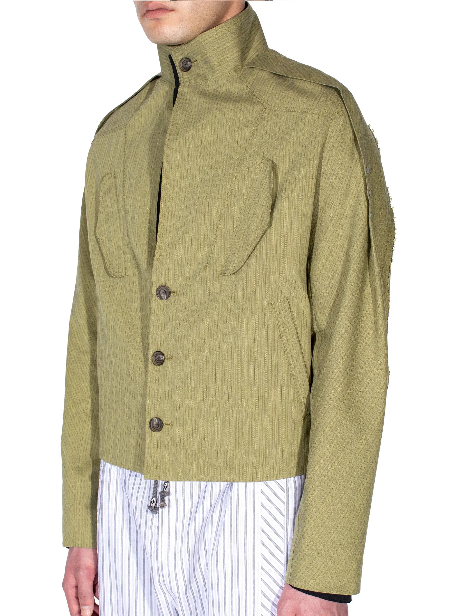 Close-up of the collar and front fastening on the Kiko Kostadinov Egreta Jacket.
