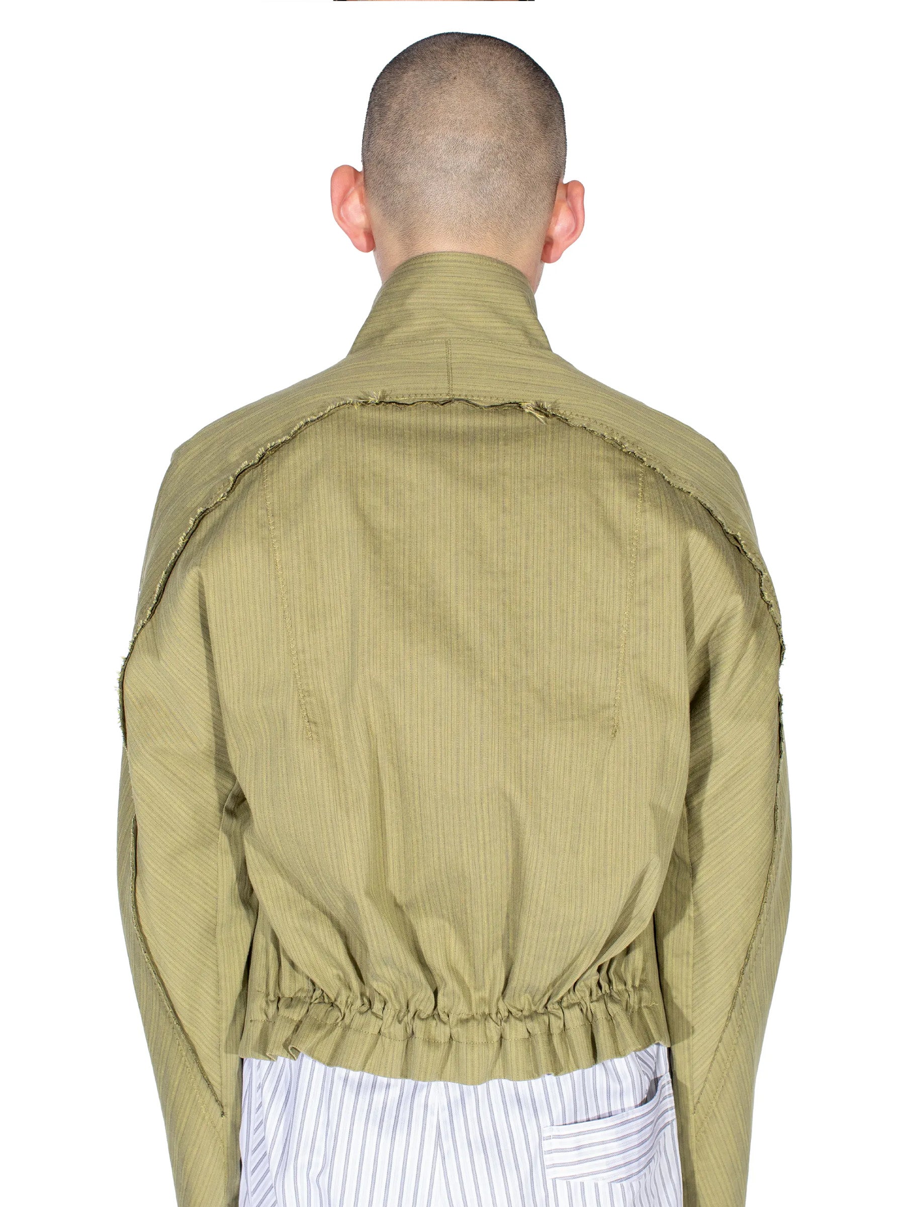 Back detail of the Kiko Kostadinov Egreta Jacket showing the elasticated hem and yoke construction.