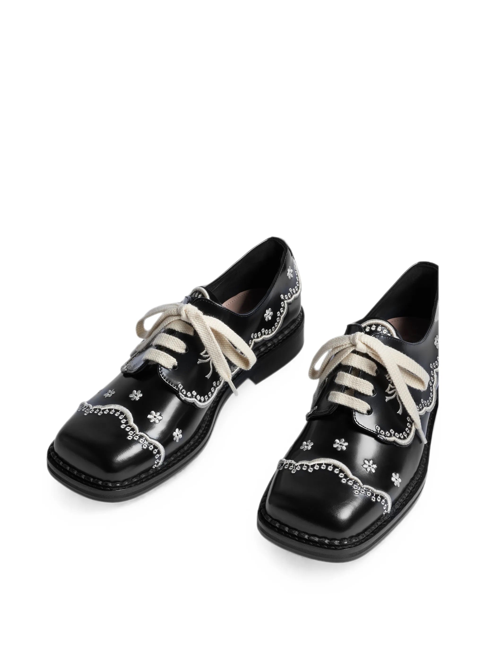 Simone Rocha Floral Lace Brogue in Black/Cream angled front view showing lace-up fastening

