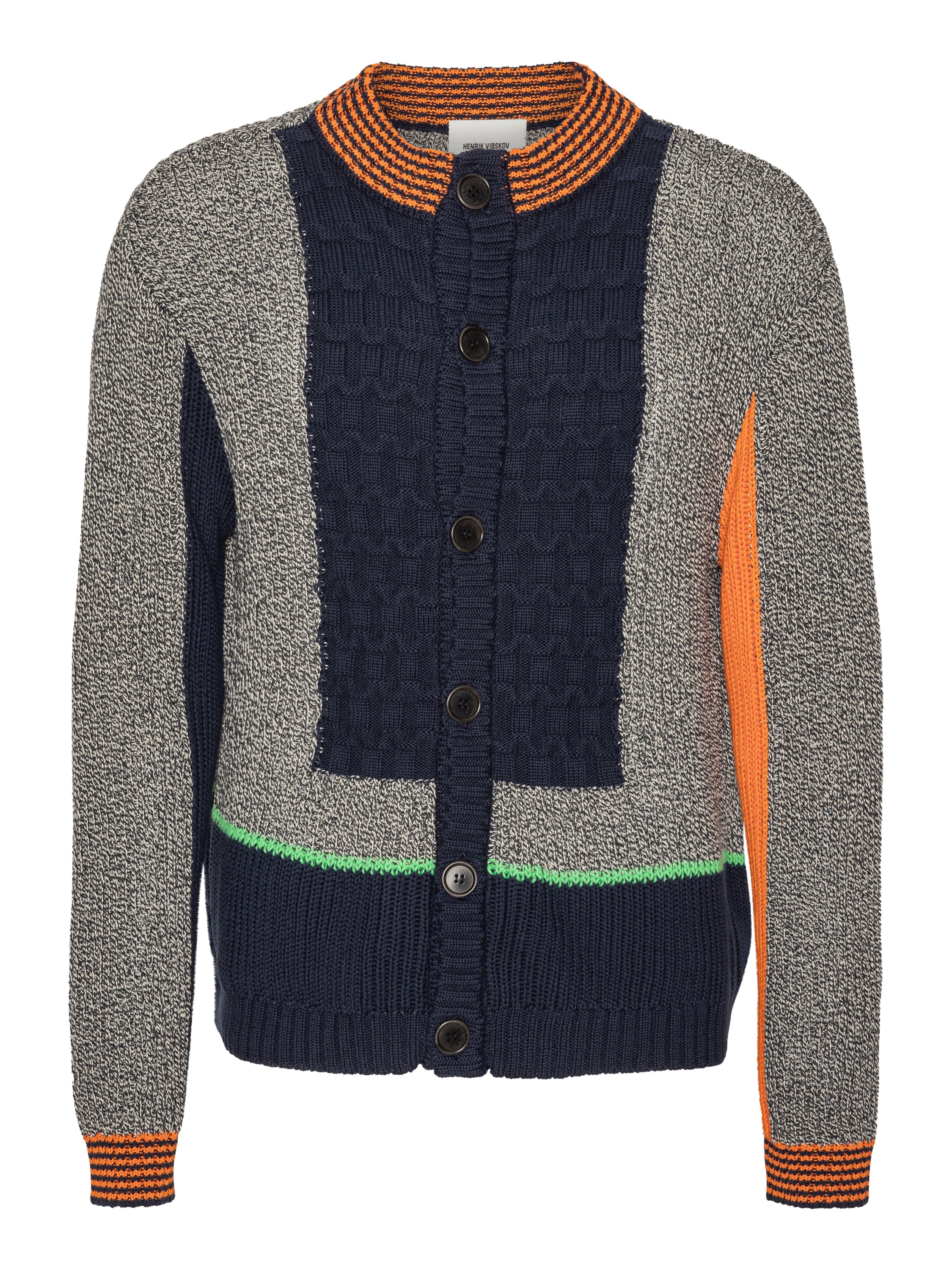 Front full-body packshot of the Abundance Cardigan from Henrik Vibskov’s SS26 collection, featuring a black, white, and navy block design with orange details, long sleeves, front button closure, and a straight hem