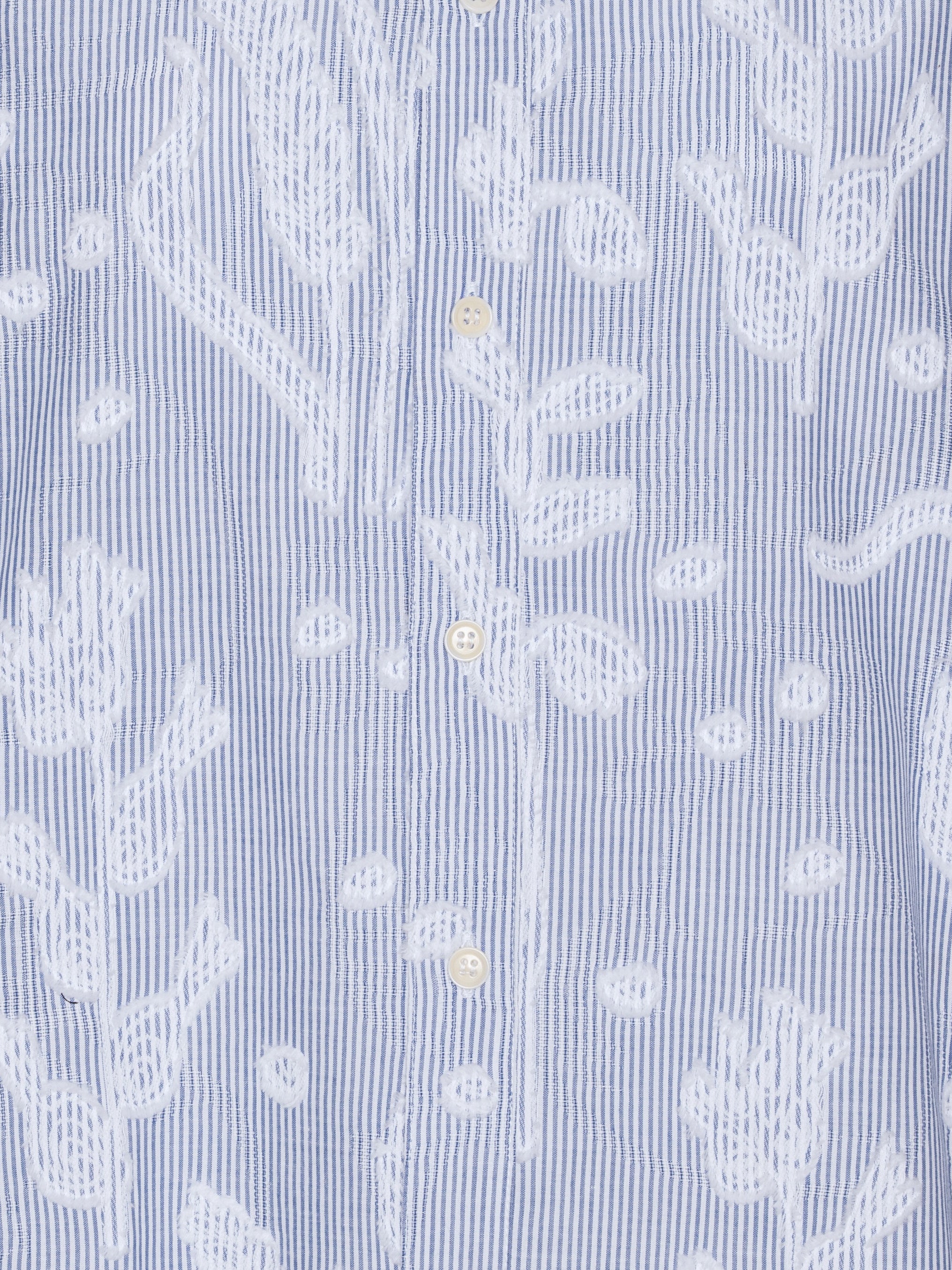 Close-up of embroidered white flower details and classic collar on the Block Shirt in Crops striped shirt – Henrik Vibskov Spring/Summer 2026 Key Collection