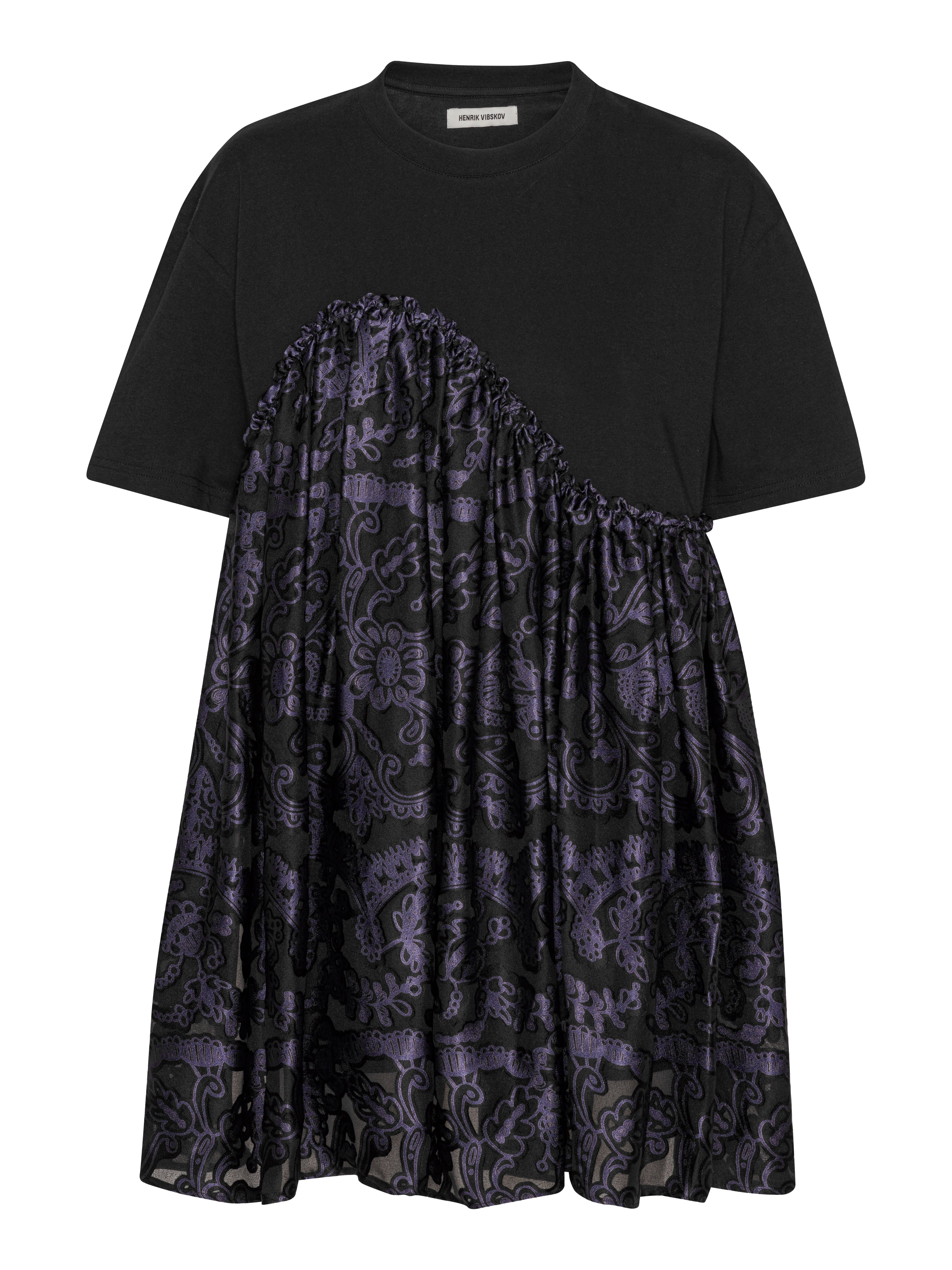 Henrik Vibskov Bon Chalant Tee in black, front view, round neck and shirt sleeves with subtle black and purple floral print, loose sculptural fit from SS26 collection.