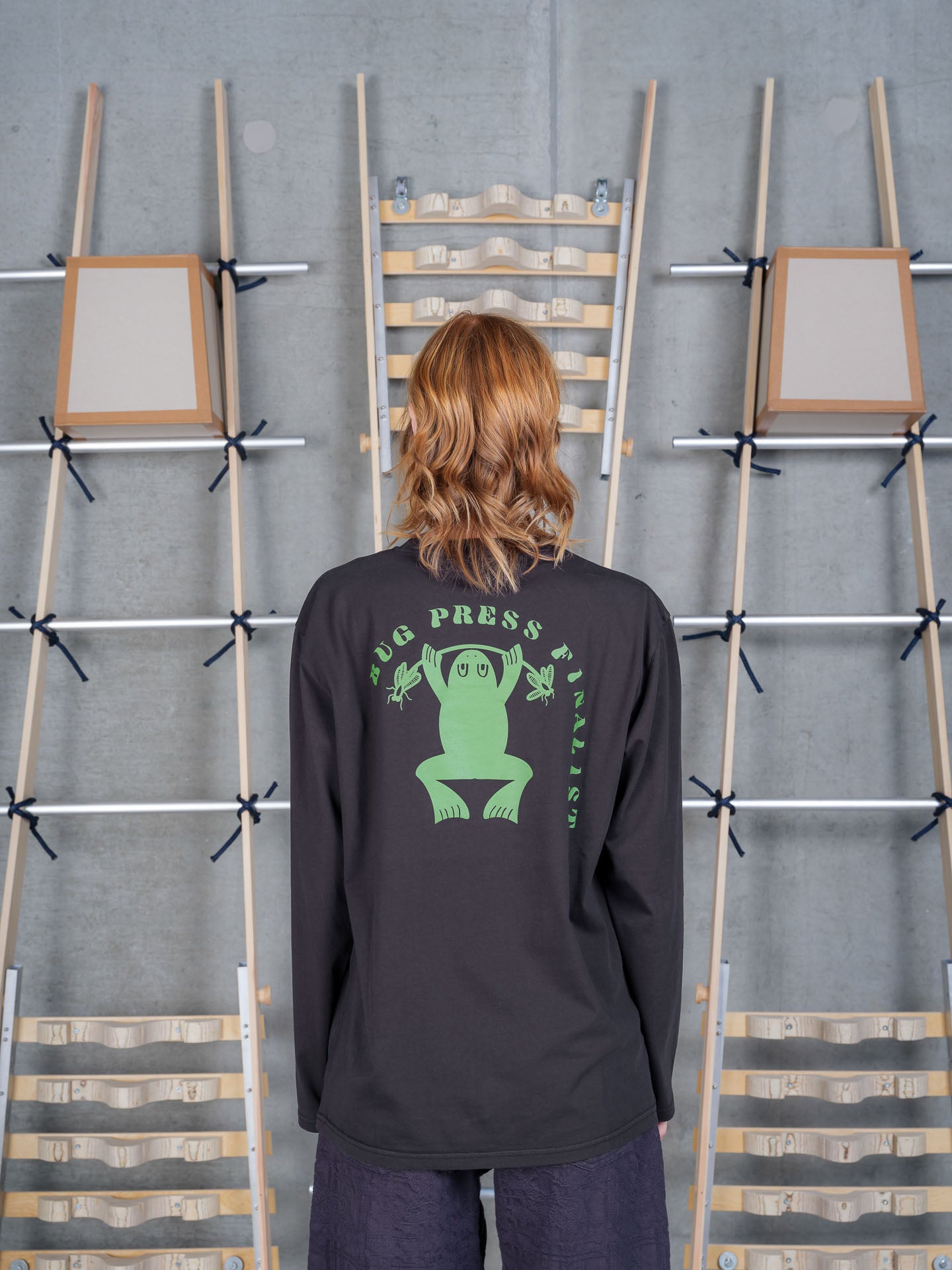Henrik Vibskov Bug Press Blouse in Black on-model back view, relaxed fit, long-sleeve crew neck, solid black back panel