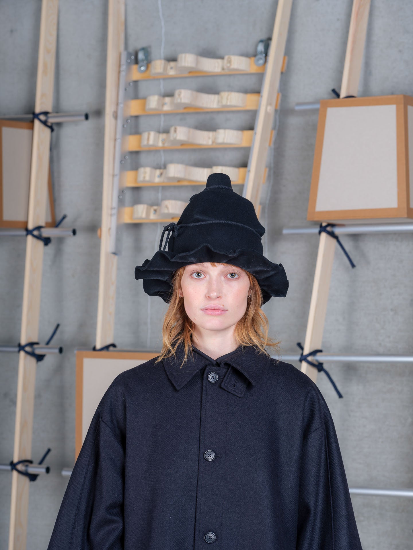 Henrik Vibskov black wool wrap hat with sculptural crown, irregular brim and handmade rope tie detailing