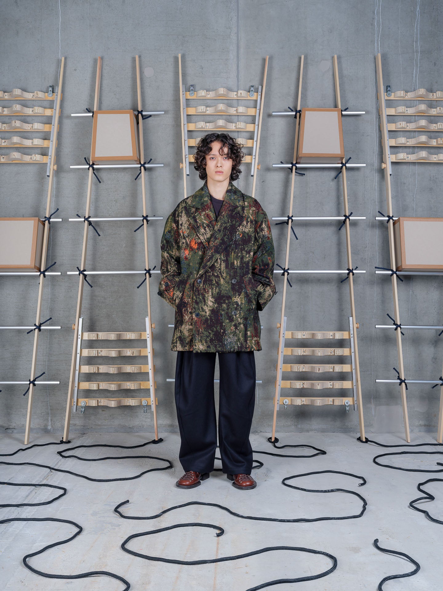 Henrik Vibskov Dimout Coat in Gobelin Swamp on-model front view, abstract tapestry print detail, notched lapel, double-breasted button front