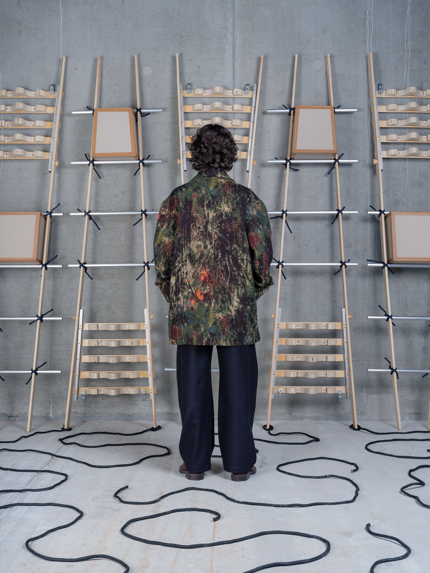 Henrik Vibskov Dimout Coat in Gobelin Swamp on-model back view, jacquard tapestry print, oversized fit, turn-back cuffs