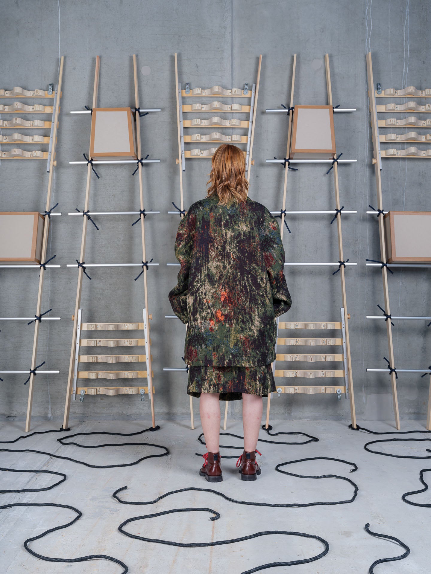 Henrik Vibskov Dimout Coat in Gobelin Swamp on-model back view, abstract tapestry print, oversized fit, turn-back cuffs
