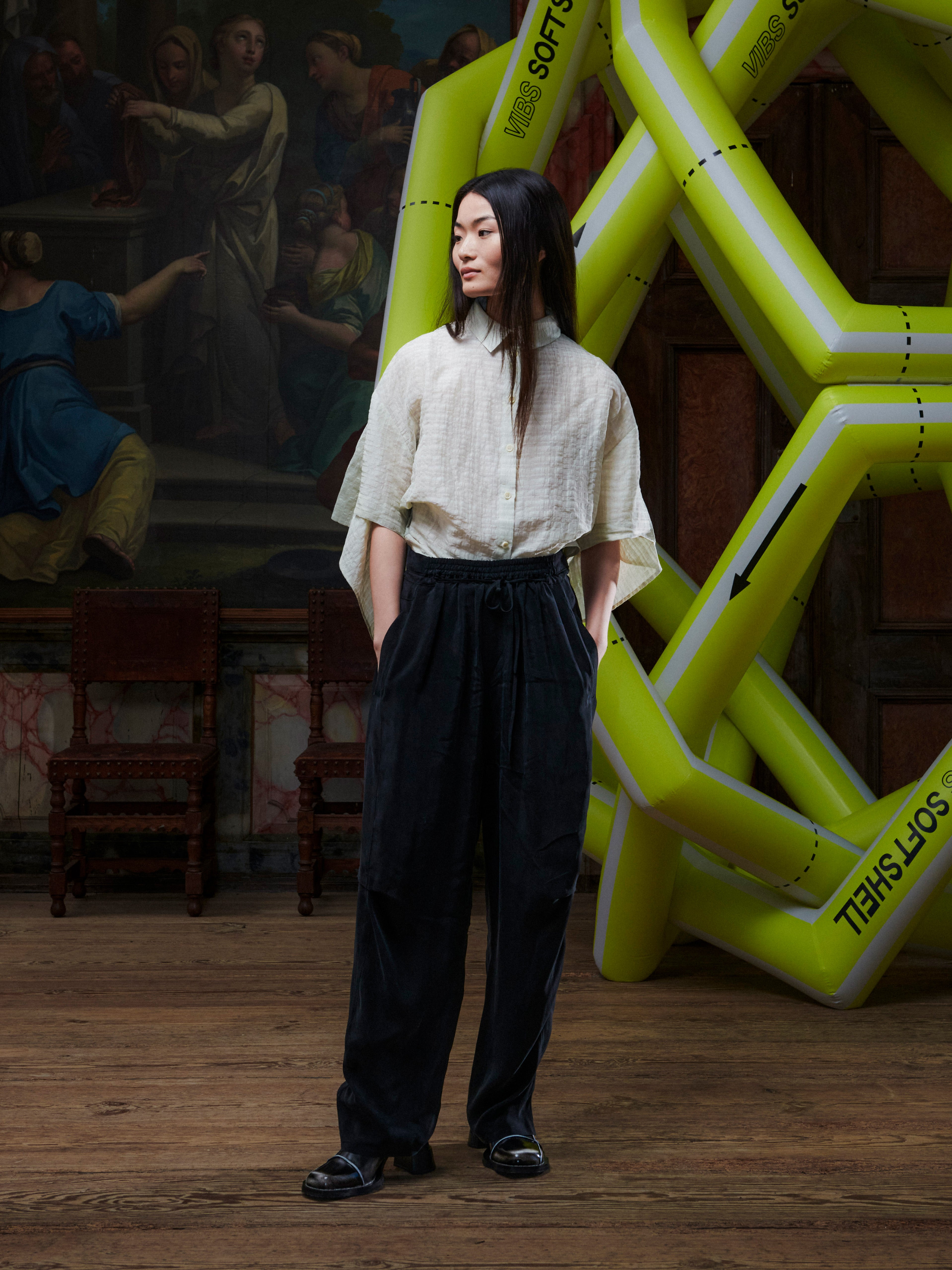 Female model wearing the Drawstring Pants in Black, front view. Model is 167 cm and wears size S, showing the relaxed straight fit and drawstring waist.
