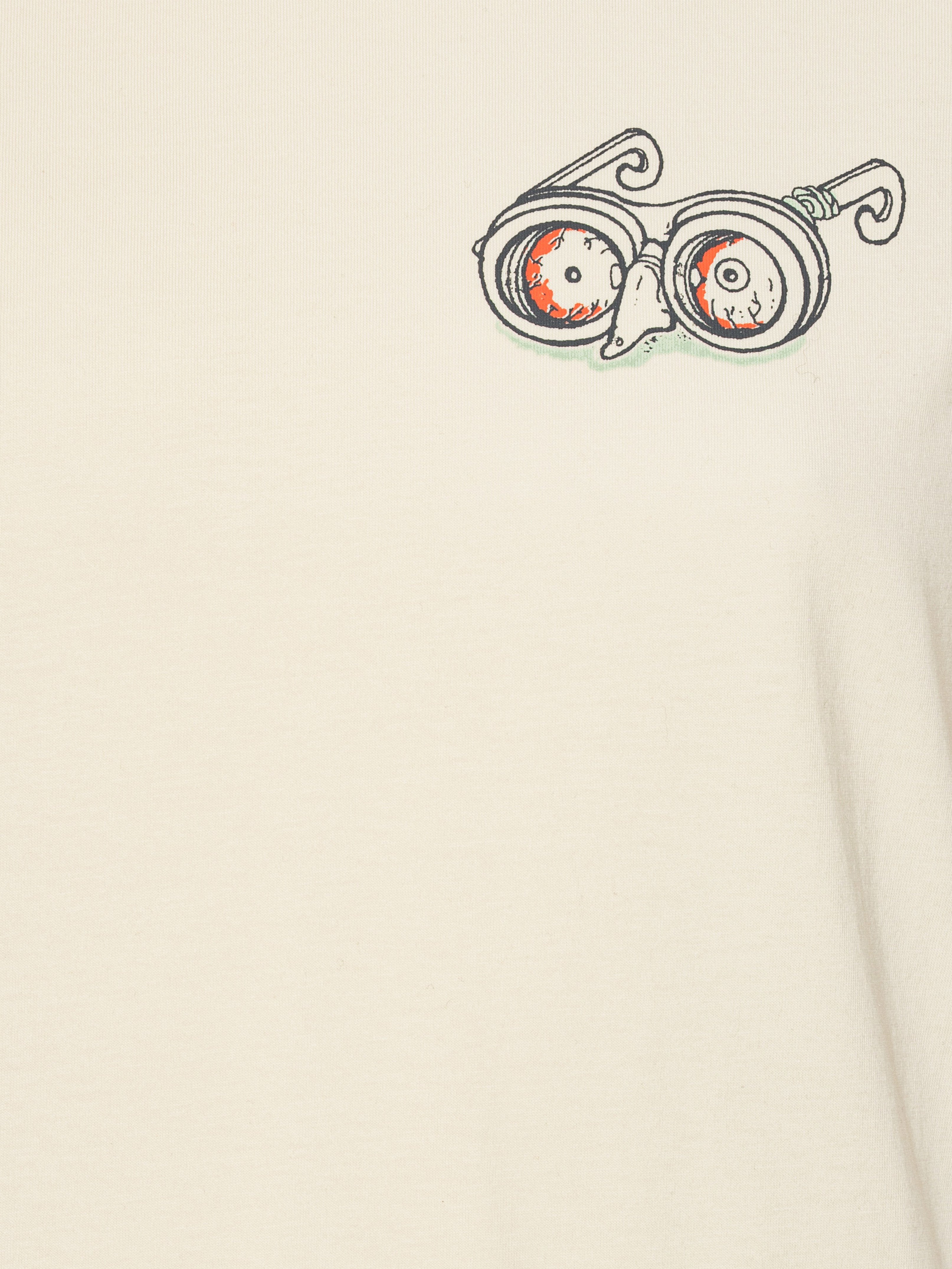 Close-up of the Henrik Vibskov Eyeballin T in Bone White, highlighting the eyeball illustration and fabric texture.