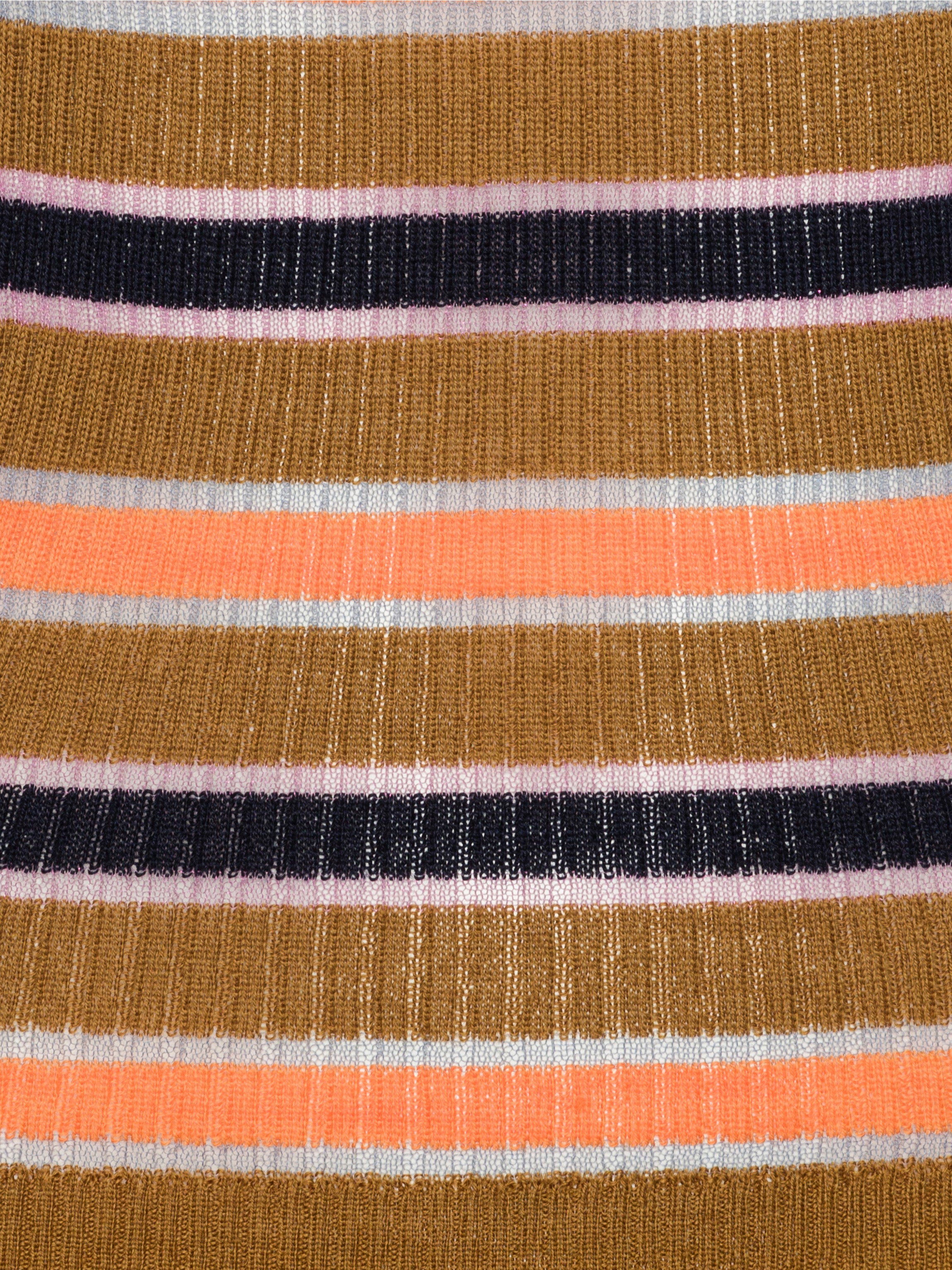 Close-up of fabric with multicolored stripes in brown, orange, black, and silver.