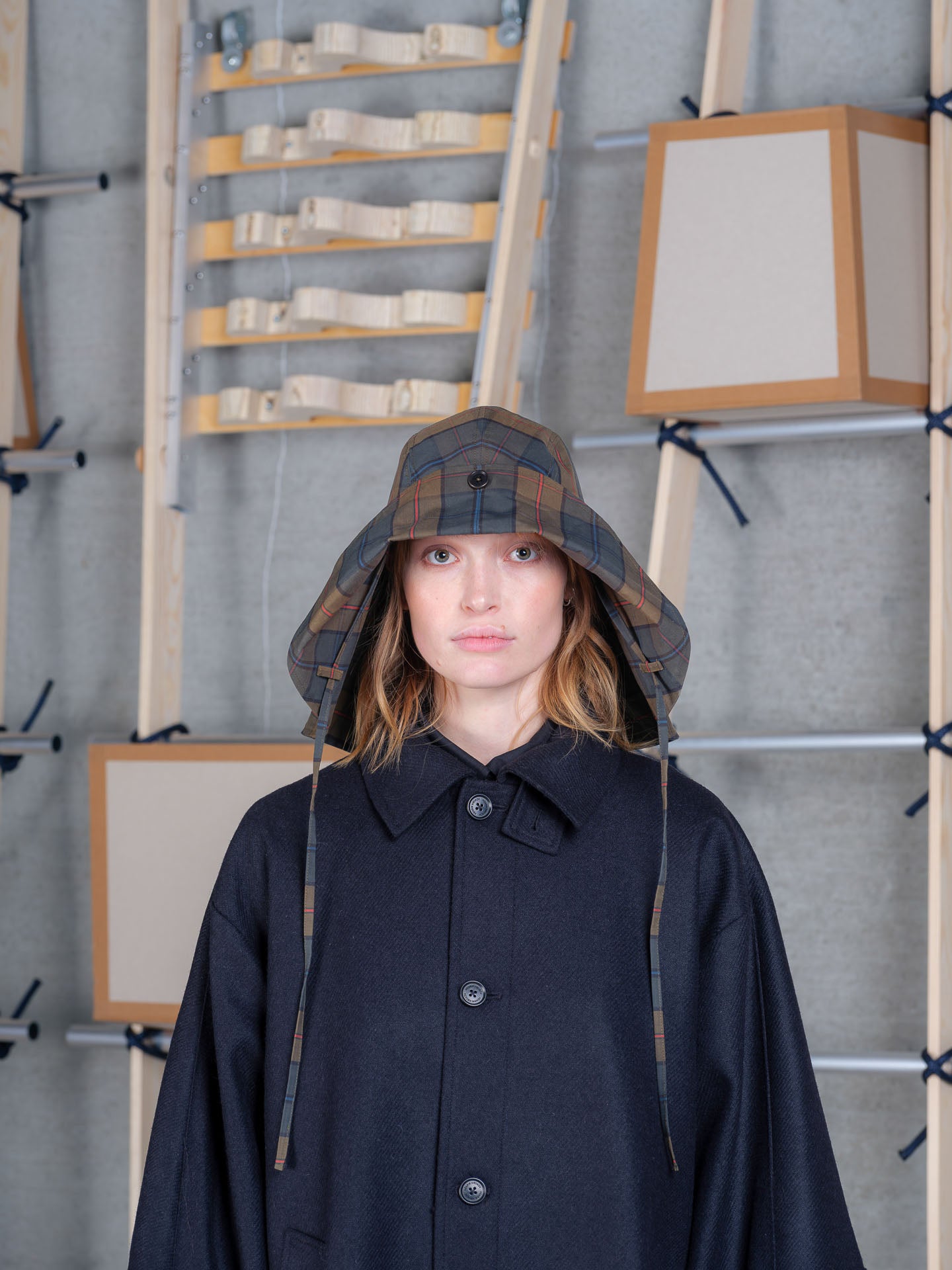 Henrik Vibskov tartan fisherman hat with dry wax finish, button detail and structured wide brim