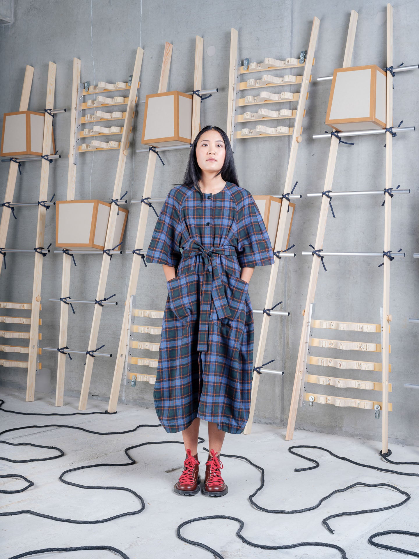 Model wearing the Henrik Vibskov One Dress in Blue Flannel Checks, front view