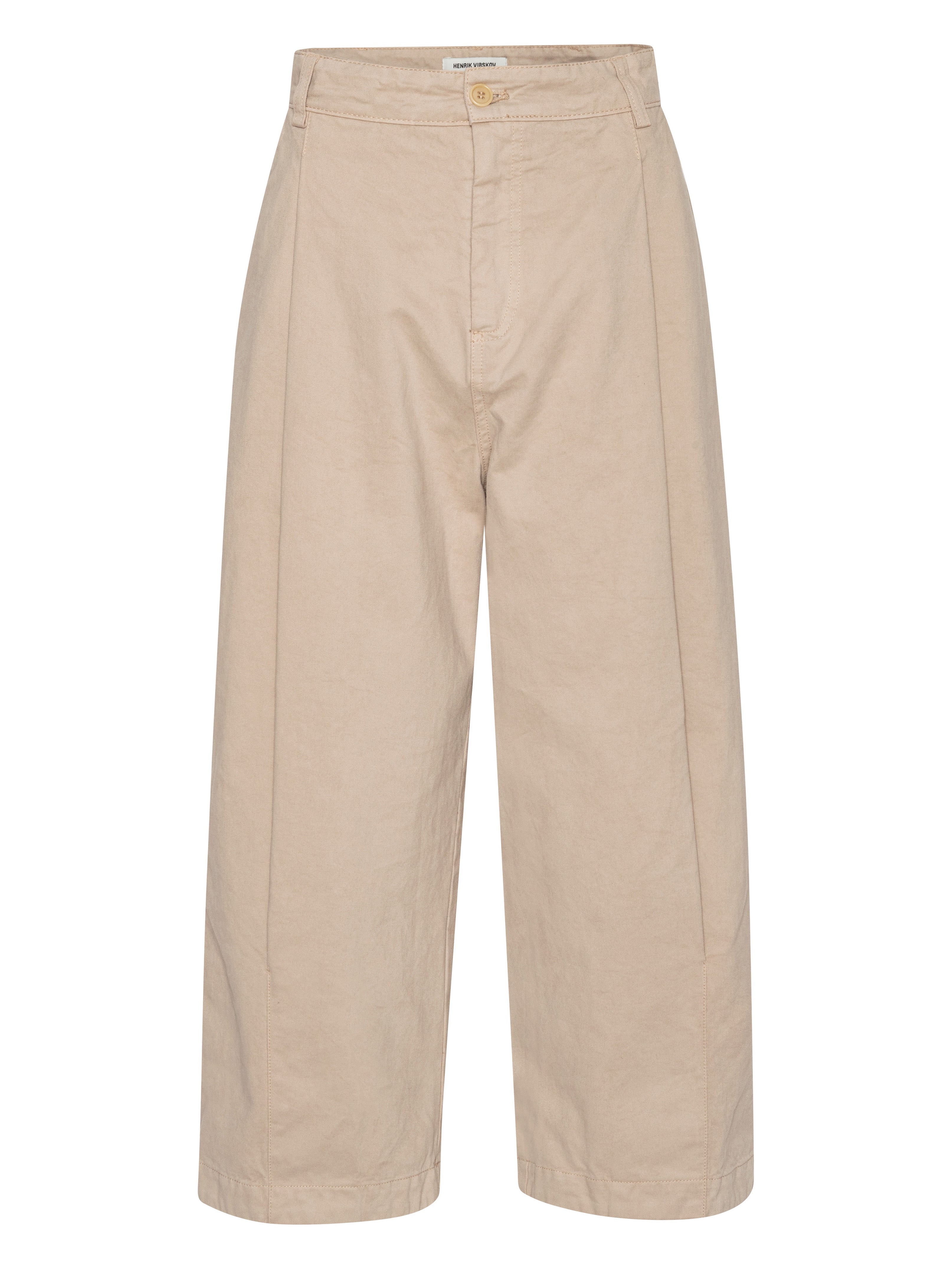 Front view of the Henrik Vibskov Open Dart Pants in sand beige, showing the pleated front, button fly, belt loops, side pockets, and cropped wide-leg silhouette.