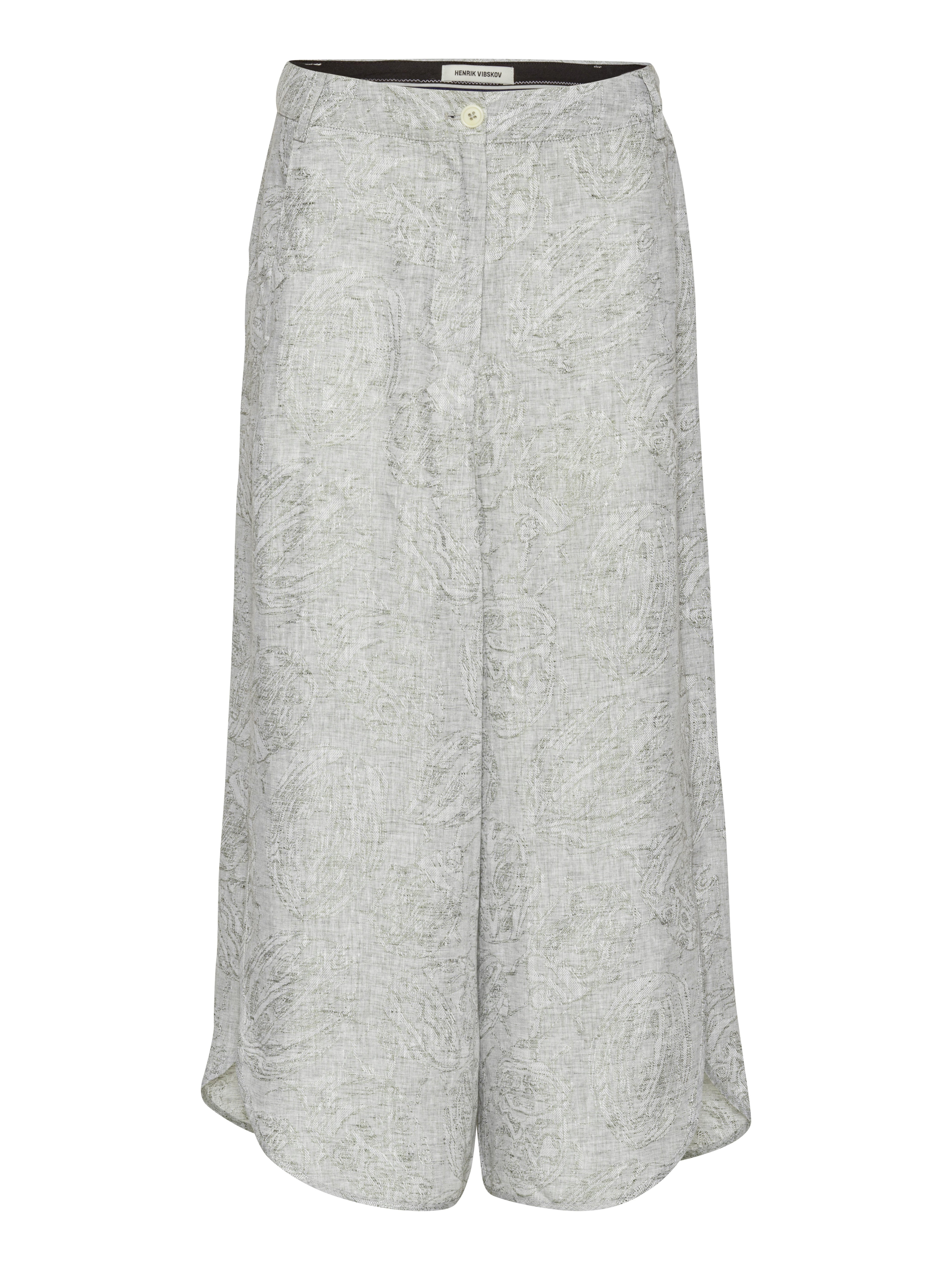 Front view of Henrik Vibskov Overlap Pants in grey textured floral fabric with wide legs and curved hem.