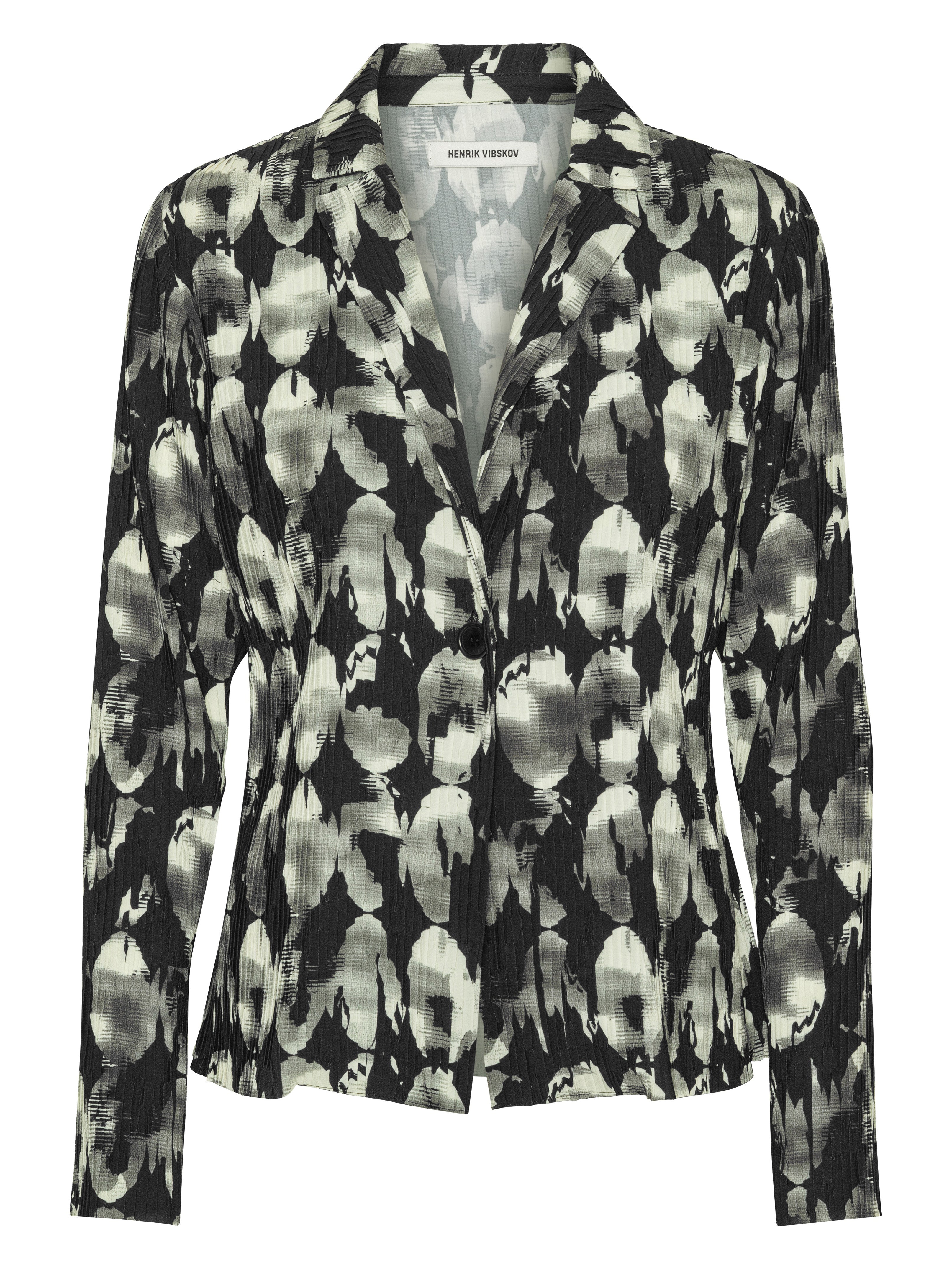 Front view of the Henrik Vibskov Plissé Blazer in Bursting Eggs, showing the black, grey, and off-white abstract egg illustration, classic blazer collar, full plissé texture, long sleeves, and fitted silhouette.