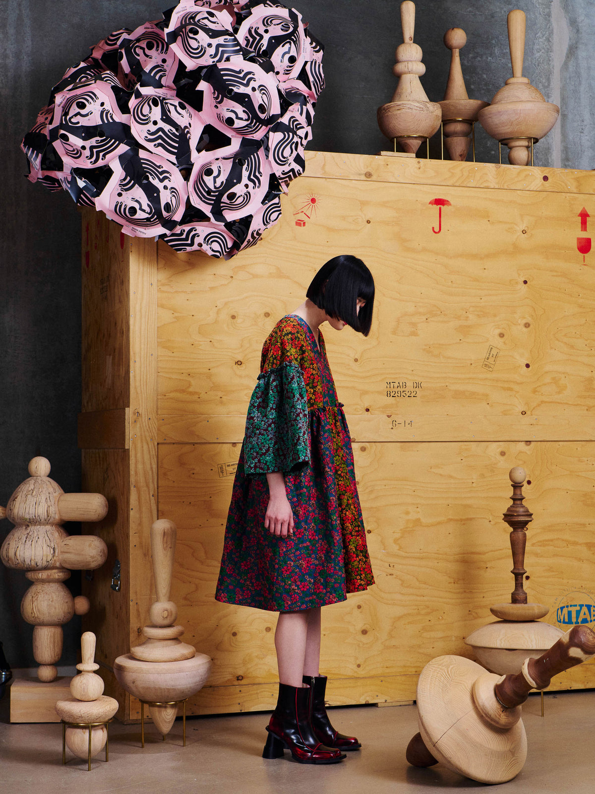 Side view of model wearing the Henrik Vibskov Pumpkin Dress in Floral Affairs, showing the gathered waist and wide three-quarter sleeves.