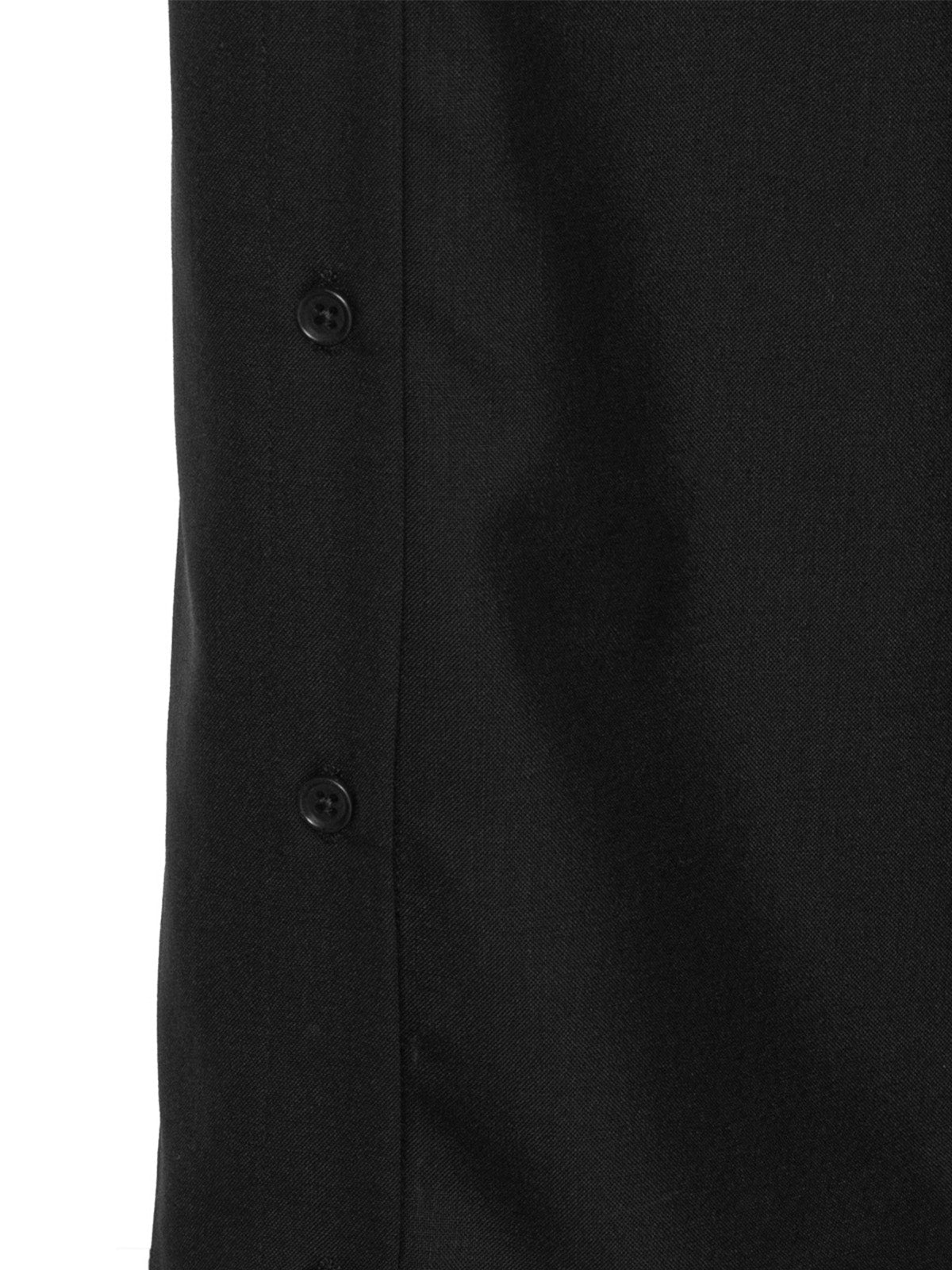 Close-up of the side seam snap button detail on the Henrik Vibskov Ravioli Slit Pants in black