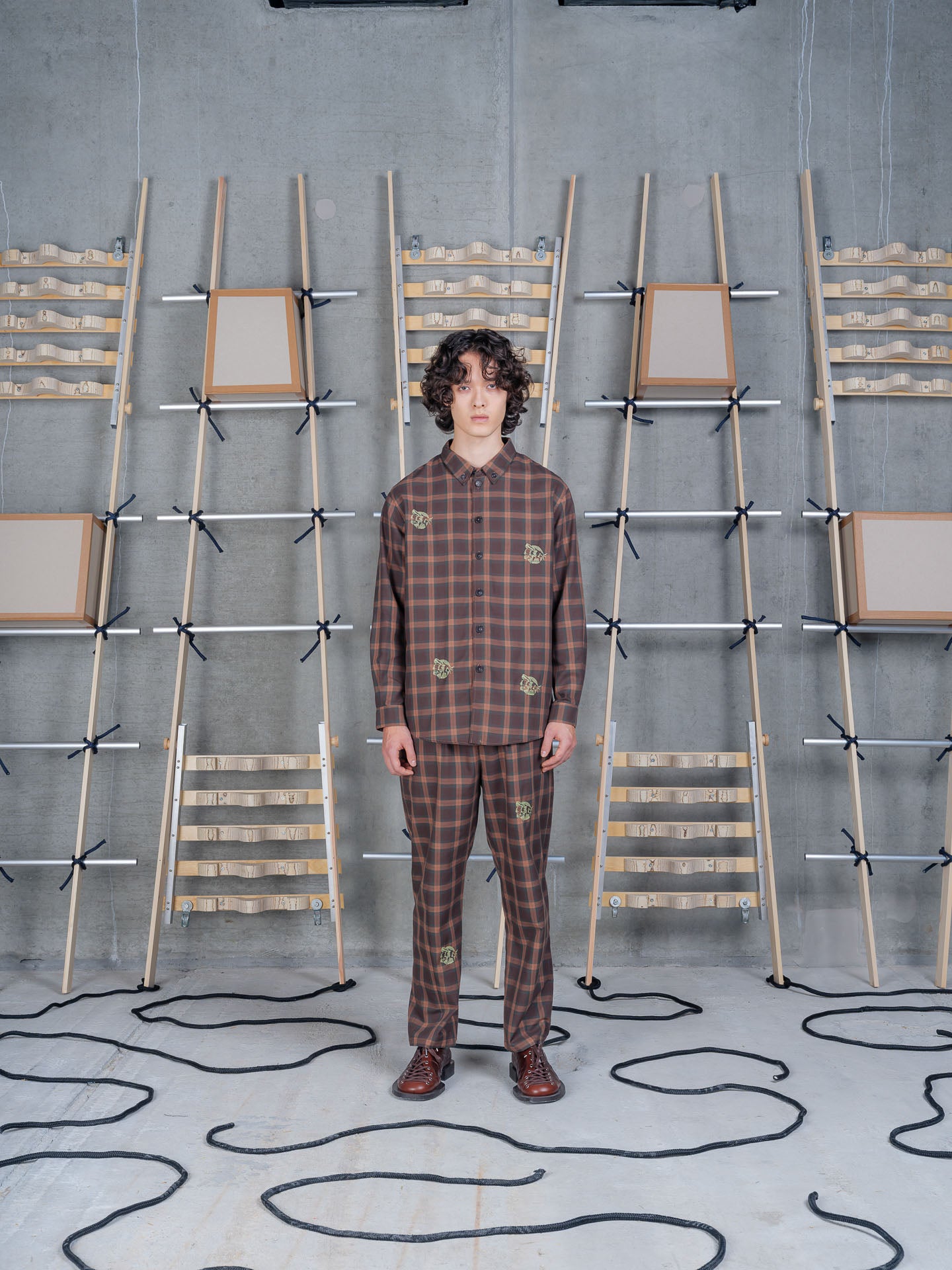 Henrik Vibskov Razor Pants Brown Cotton Checks, model front view, styled as a co-ord with matching checked shirt