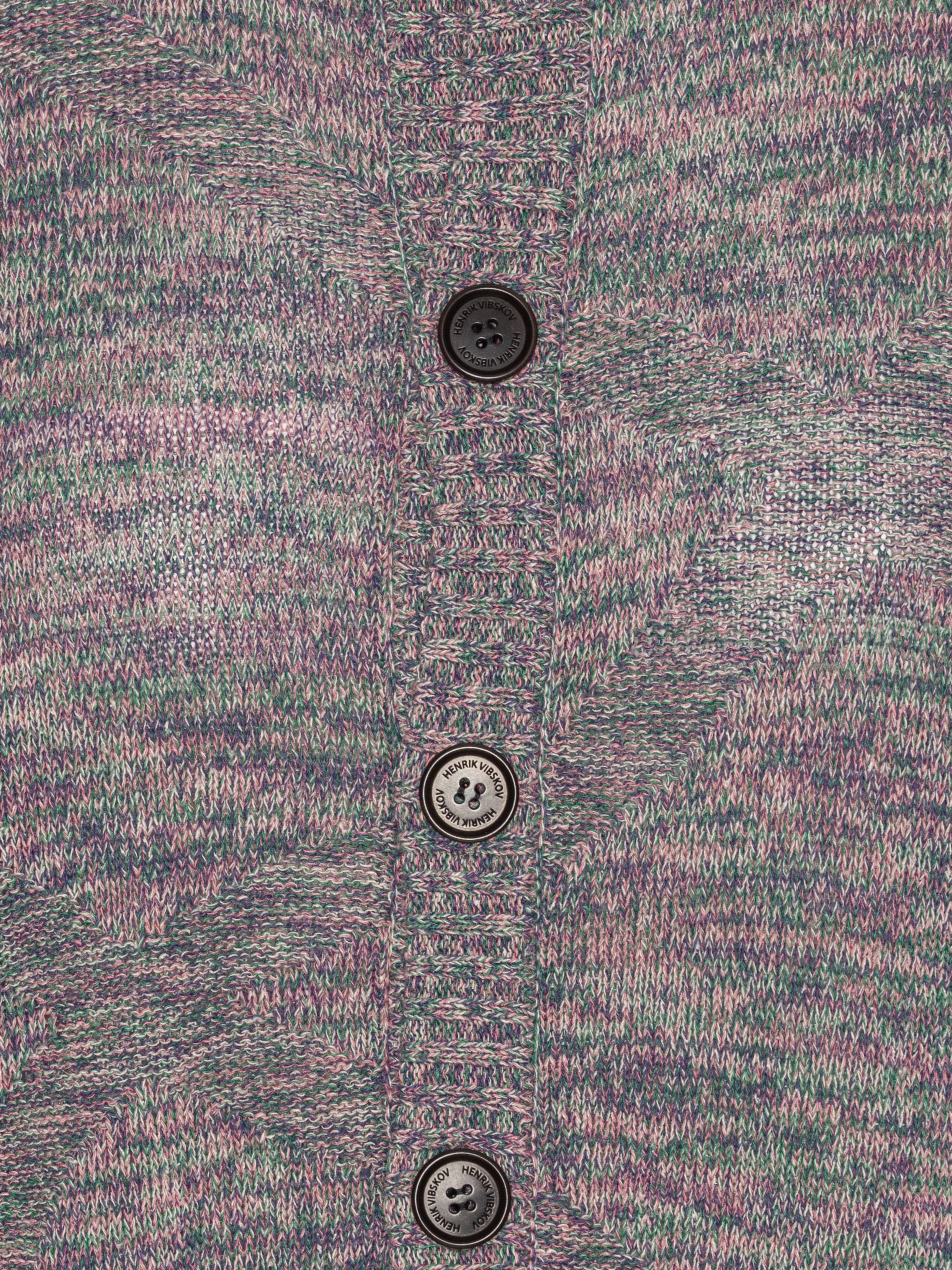 Close-up showing the textured silk net fabric, multi brown-grey color tones, and buttons of the cardigan.
